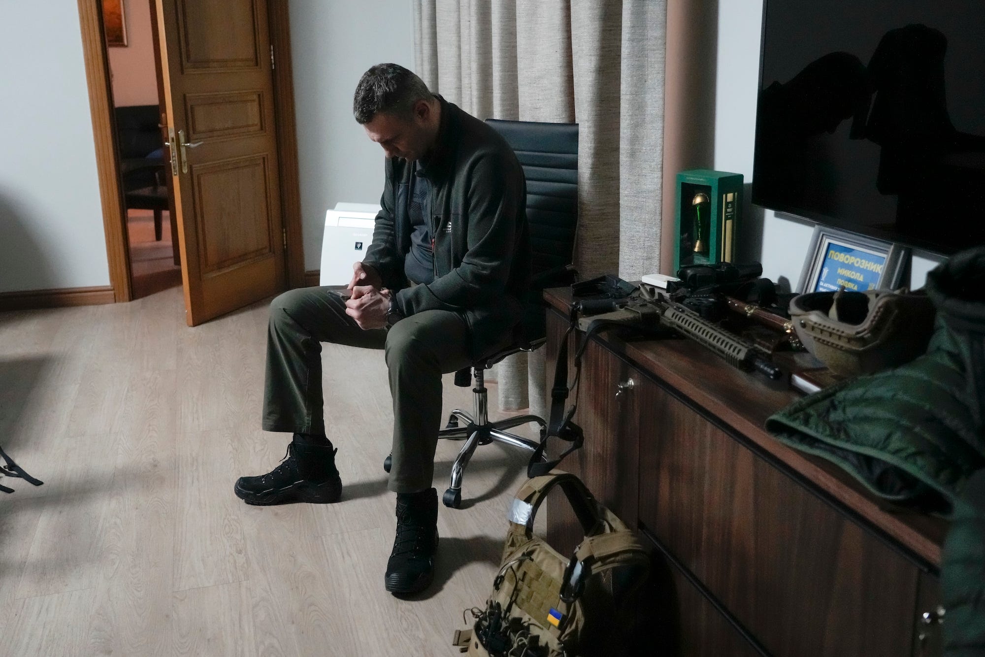 Vitali Klitschko, in his City Hall office, with war gear by his side.