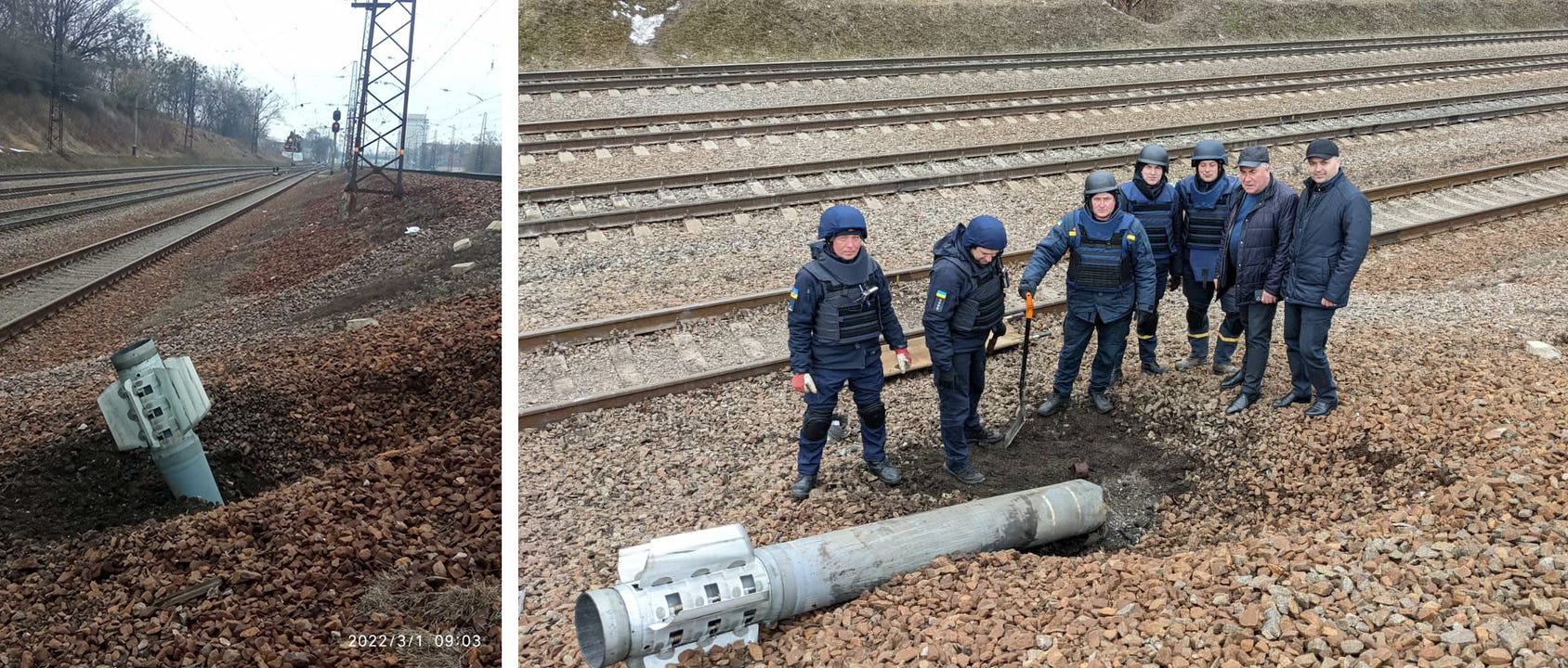 An unexploded munition is seen next to a train track with nothing else around.
