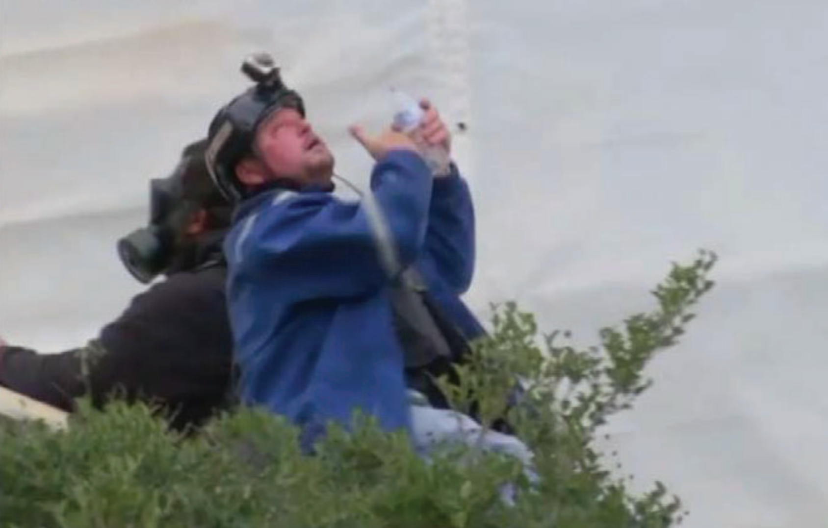 Guy REFFITT flushes his eyes out with water at the us capitol on january 6, 2021