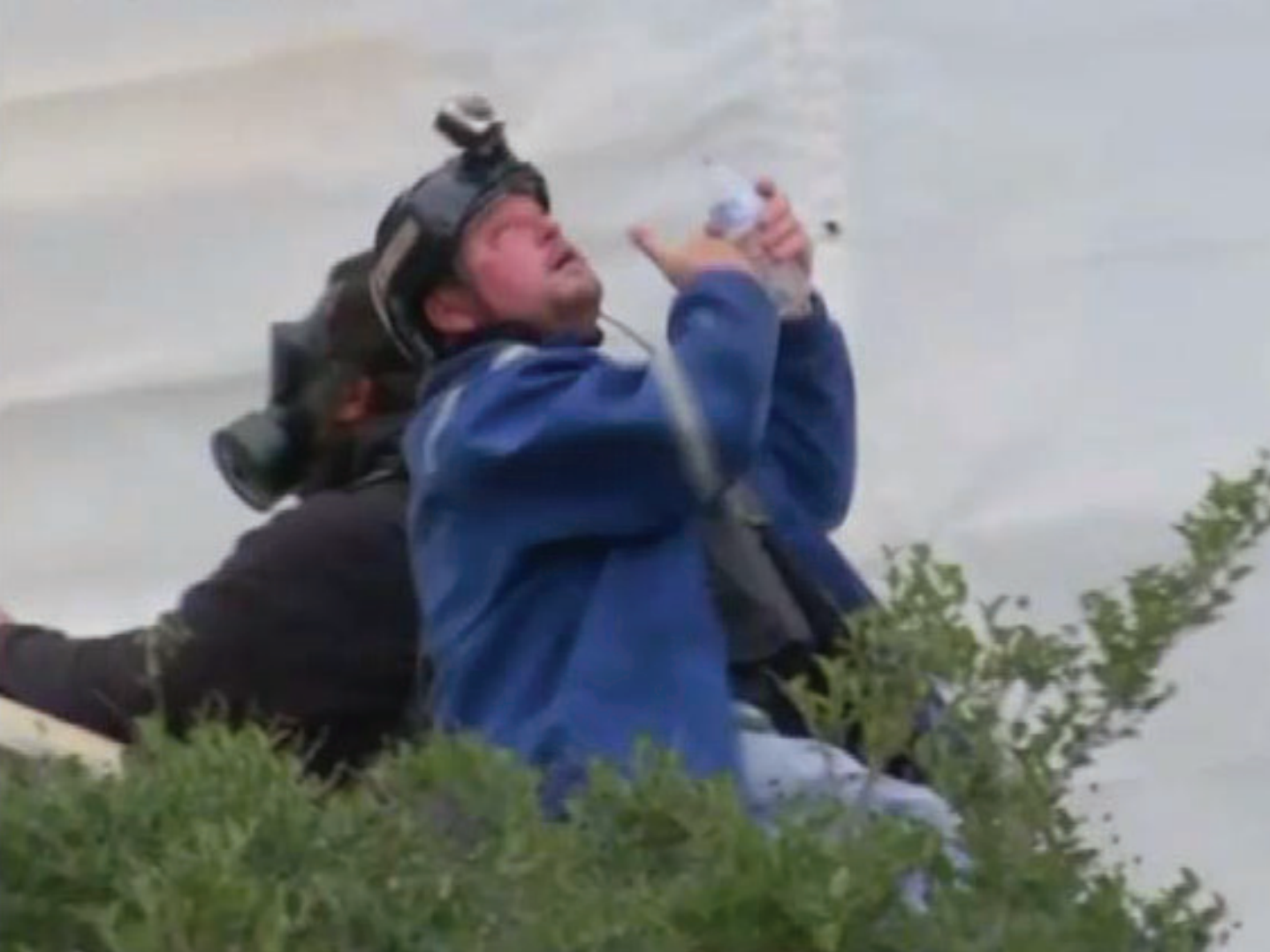 Guy REFFITT flushes his eyes out with water at the us capitol on january 6, 2021