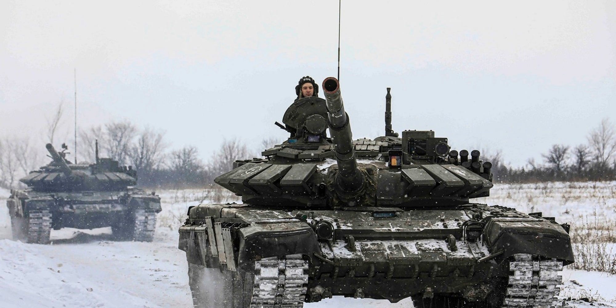 Russian tanks roll on the field in Leningrad, Russia.