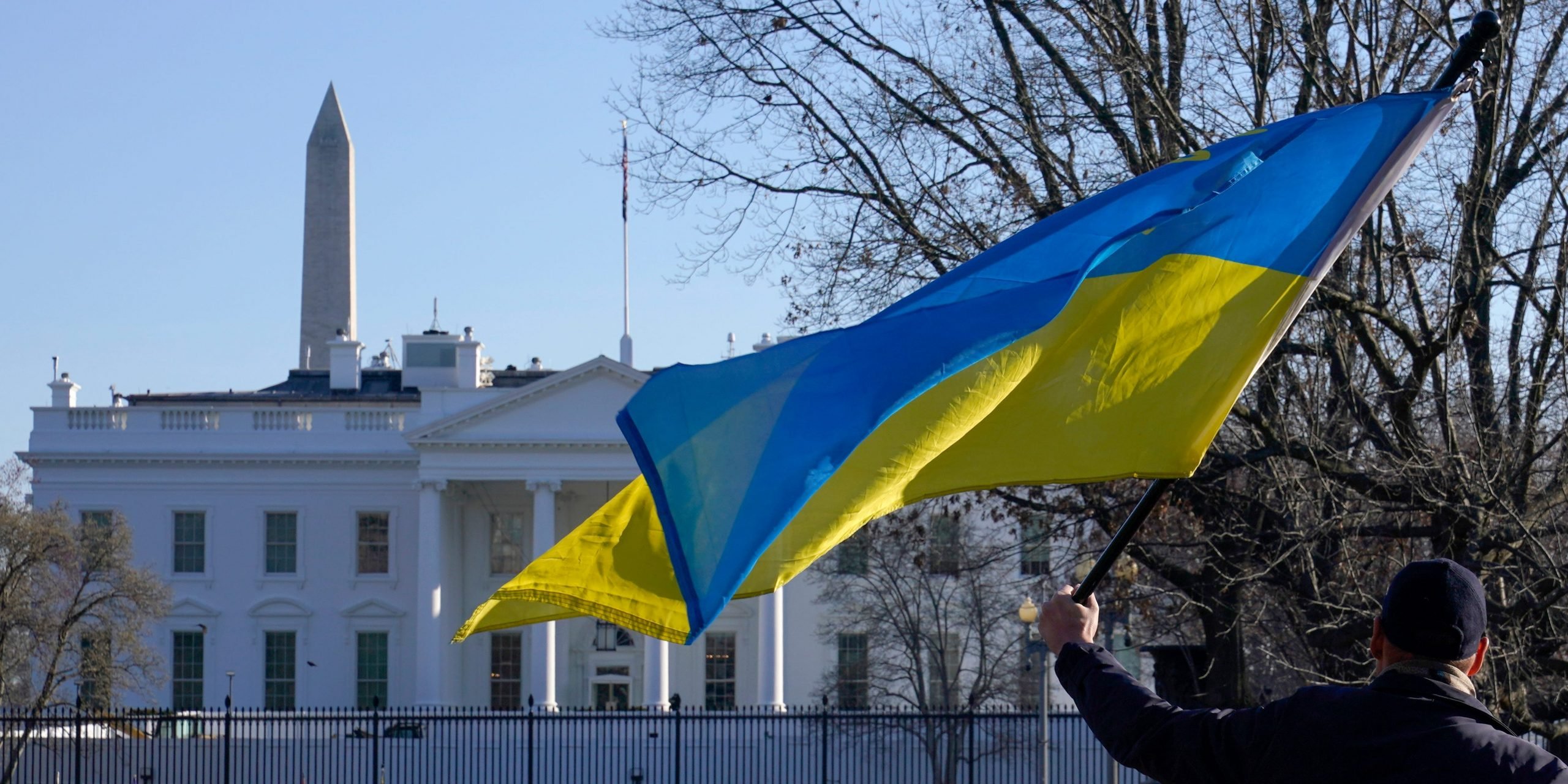 People walks toward the White House in Washington, Friday, March 4, 2022, to protest in support of Ukraine and asking that the United States to do more to help Ukraine defend itself from the Russian invasion.