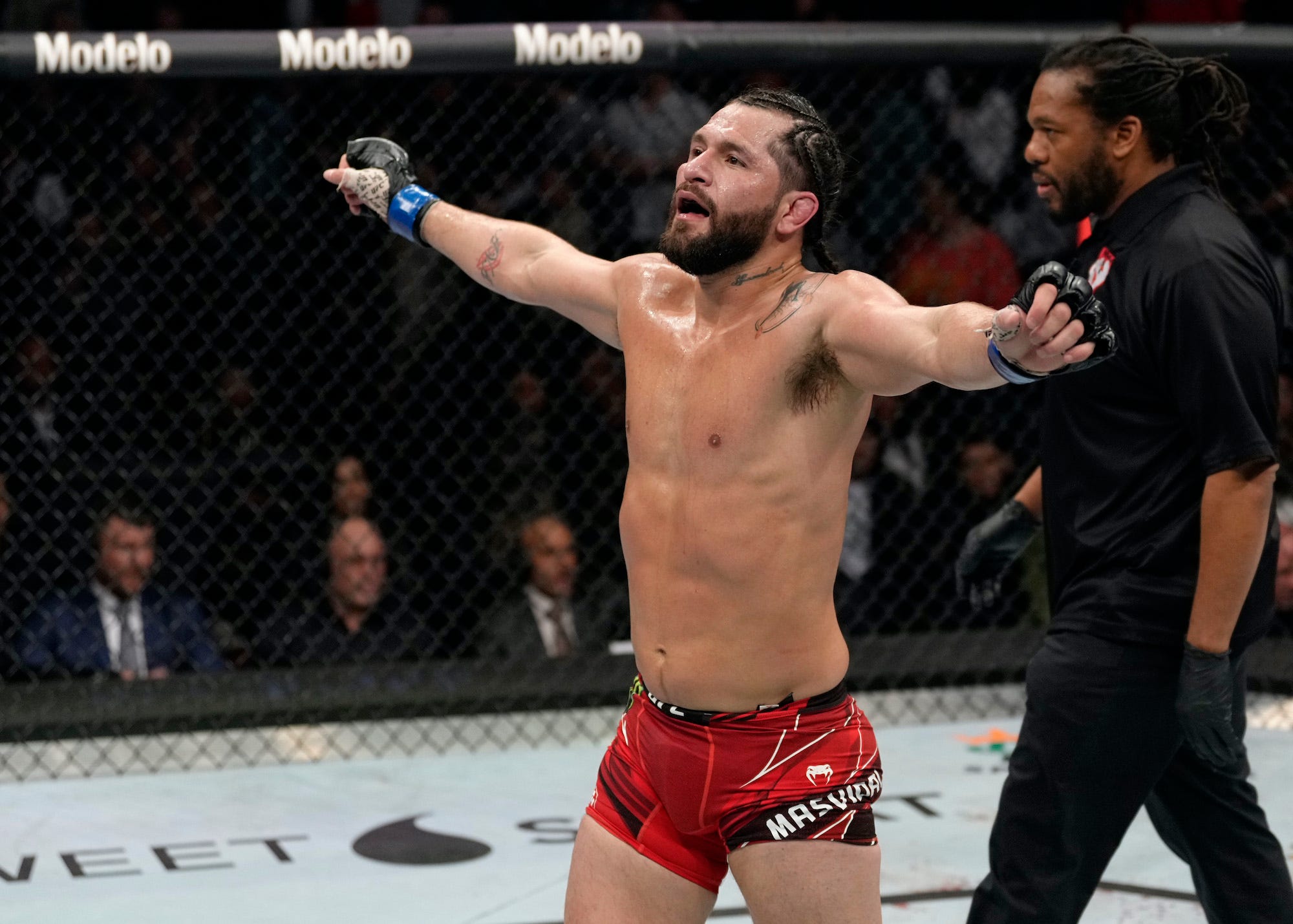 Jorge Masvidal celebrates between rounds.