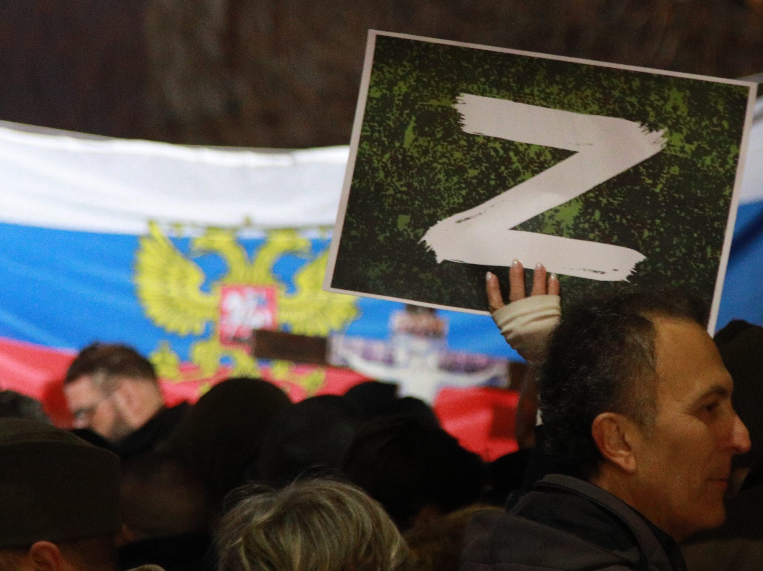 A protester holds a "Z" sign banner, in reference to Russian tanks marked with the letter, during a rally organised by Serbian right-wing organisations in support of Russian attacks on Ukraine, in Belgrade March 4, 2022.