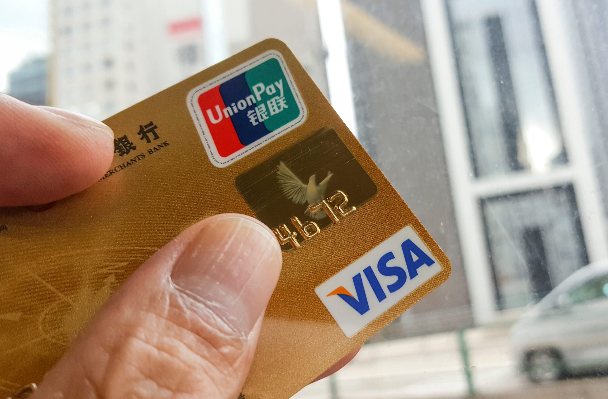 A credit card with UnionPay and VISA logo together.