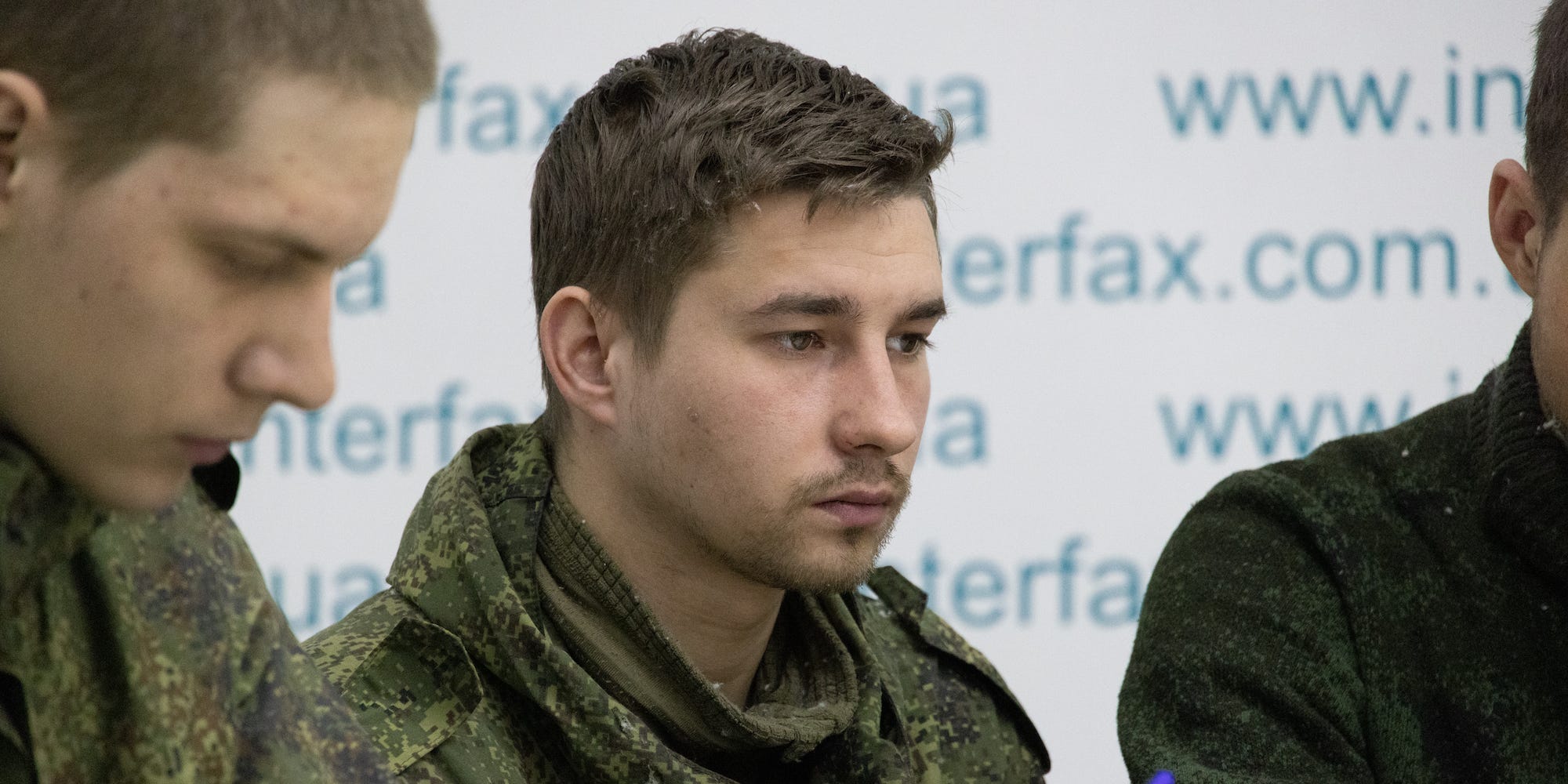 Three Russian soldiers captured in Ukraine at a press conference, March 5, 2022.
