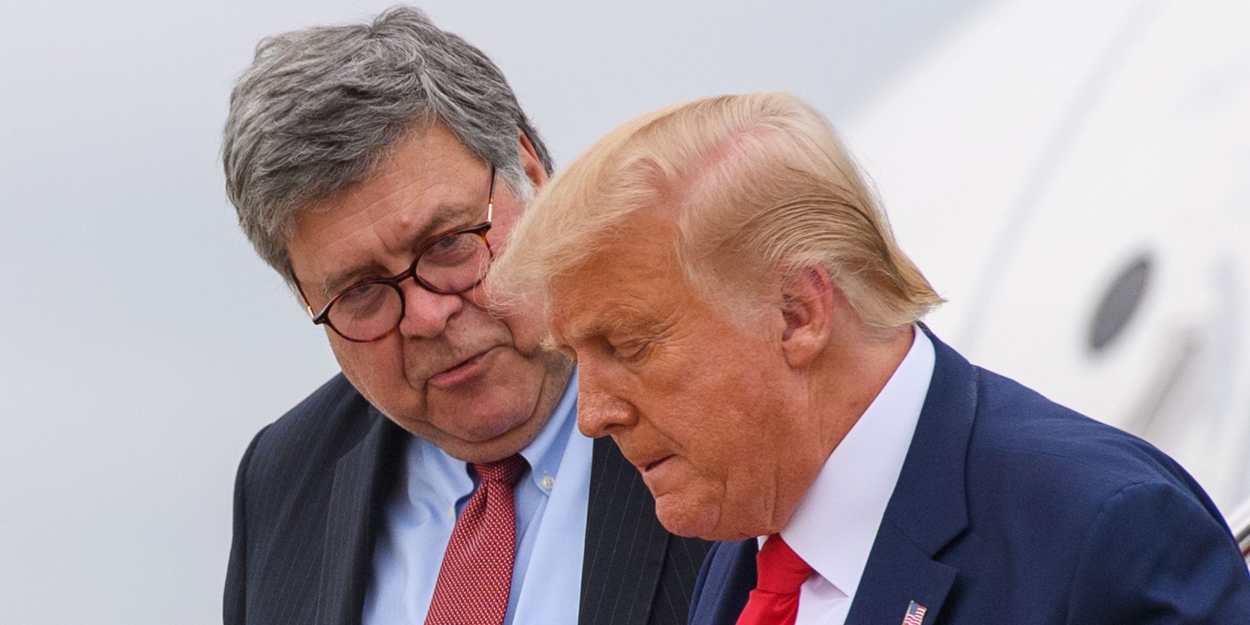 US President Donald Trump (R) and US Attorney General William Barr step off Air Force One upon arrival at Andrews Air Force Base in Maryland on September 1, 2020