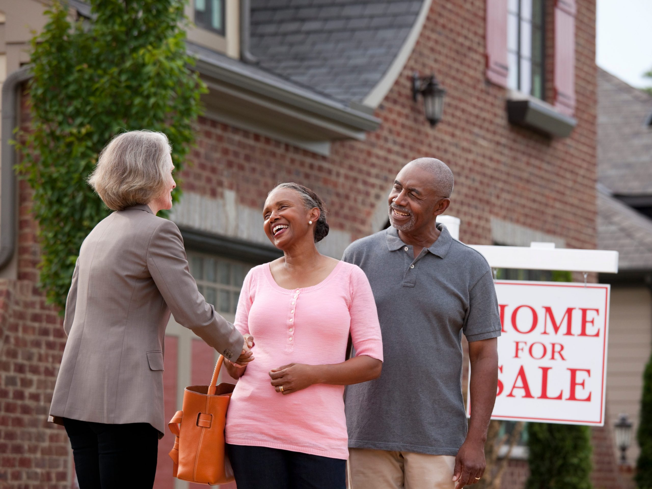 An older couple and a Realtor.