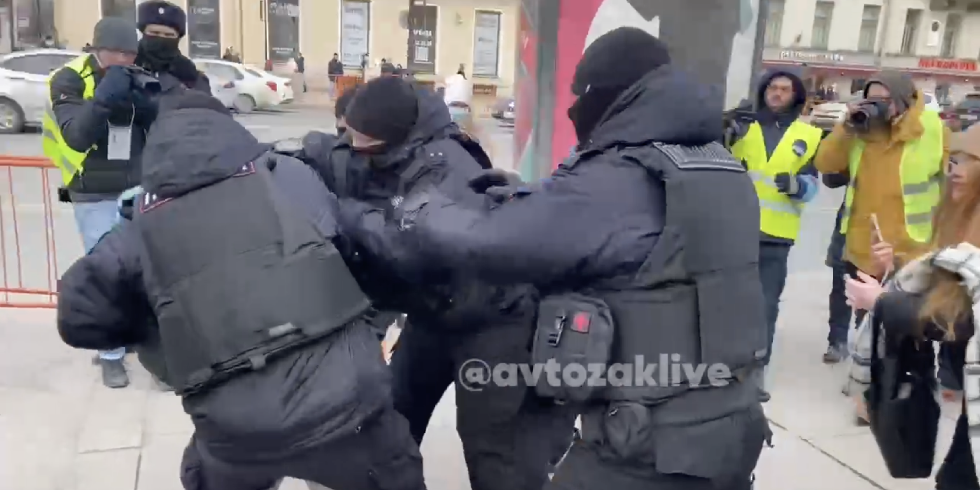 Russian police detain a protester in Saint Petersburg on Tuesday.