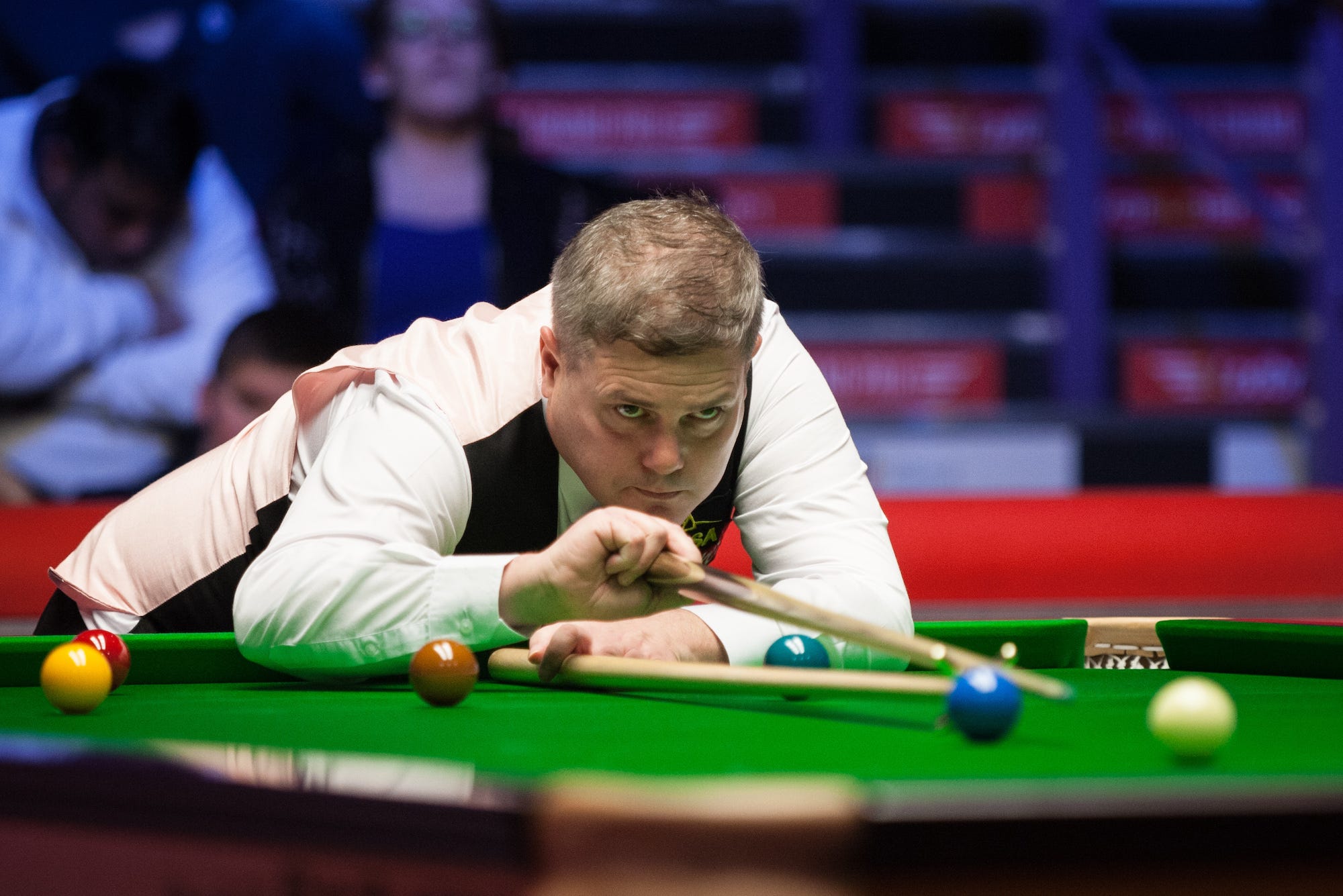 Robert Milkins of England plays a shot during his first round match against Ronnie O'Sullivan of England on day one of 2018 Ladbrokes World Grand Prix at Guild Hall