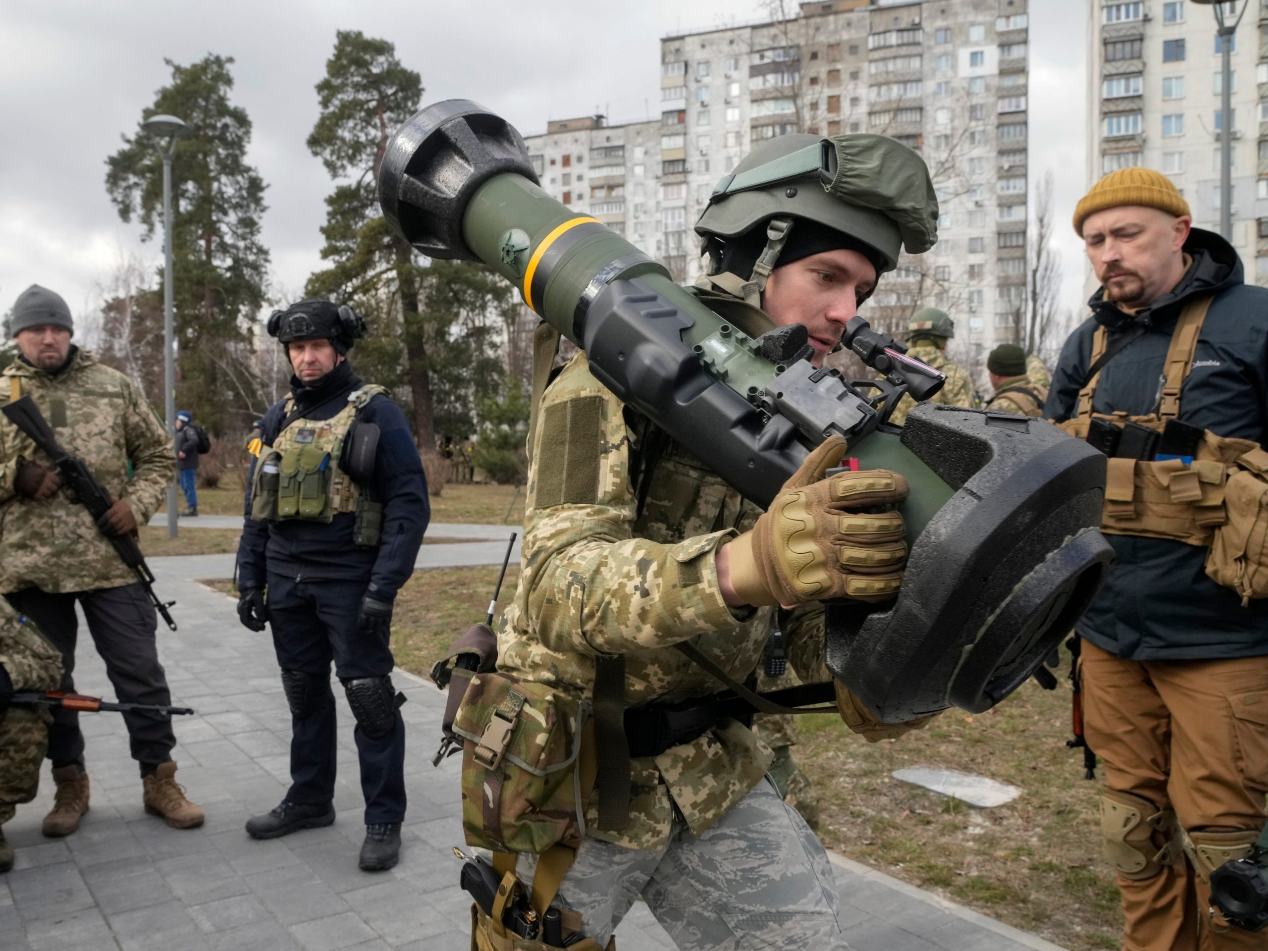 A Ukrainian Territorial Defence Forces member holds an NLAW anti-tank weapon, in the outskirts of Kyiv, Ukraine, Wednesday, March 9, 2022.