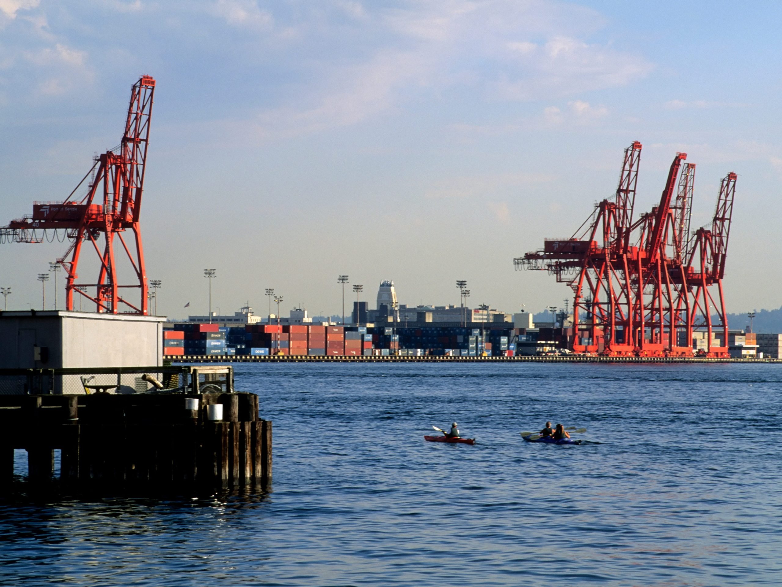 Kayakers pass Seattle's container port.