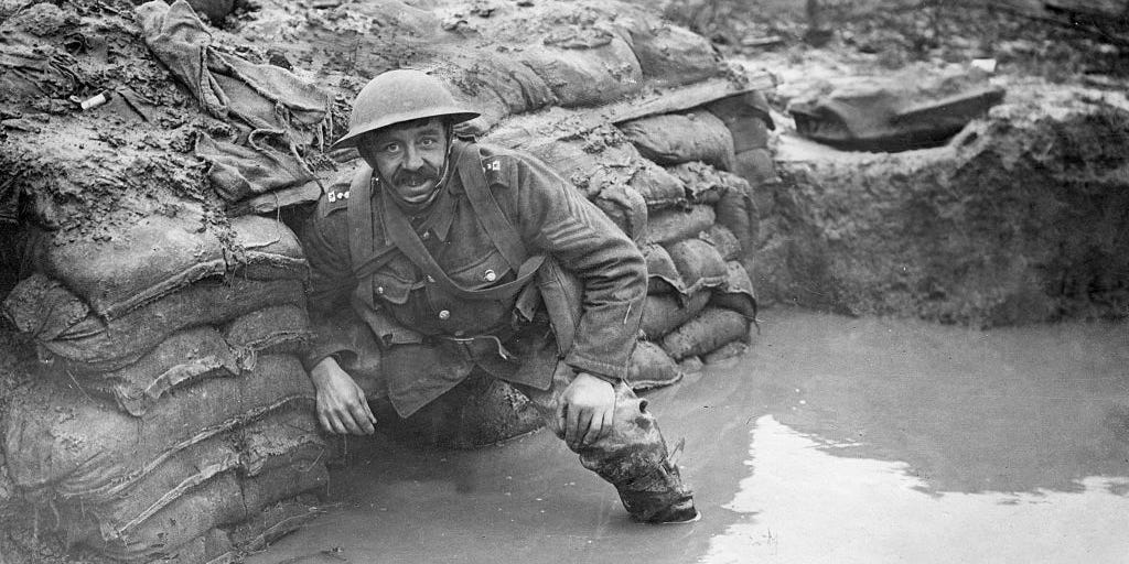 A sergeant of the Lancashire Fusiliers in a flooded trench opposite Messines near Ploegsteert Wood. Jaunary 1917.