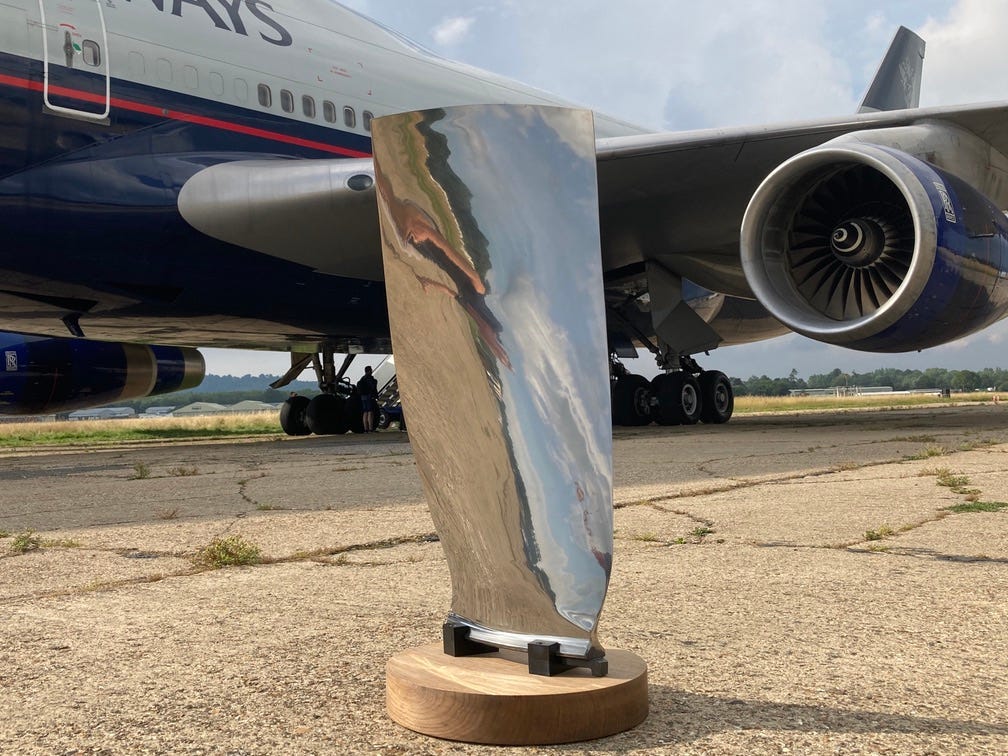 Aerotiques sculpture in front of a British Airways 747.