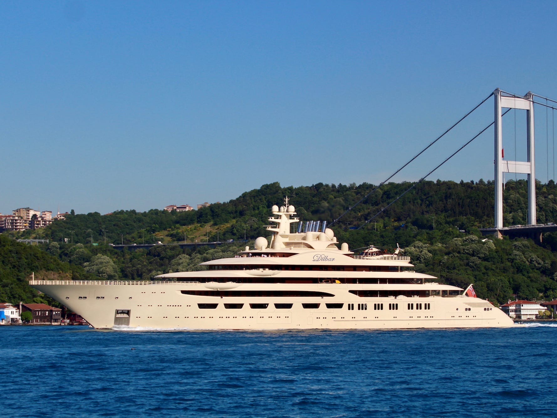 A yacht, the Dilbar, owned by Alisher Usmanov, is seen against a blue sea and sky in the Bosphorus in 2019.