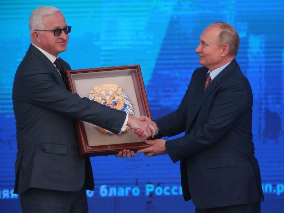 Russian President Vladimir Putin (R) gives the award to Chairman of RSPP Alexander Shokhin (L) during the plenary session of the 30th Congress of Russian Union of Industrialists and Entrepreneurs (RSPP) at the State Kremlin Palace, on December 17, 2021 in Moscow, Russia. Representatives of Russia's biggest business lobby gathered at the Kremlin for an annual congress.