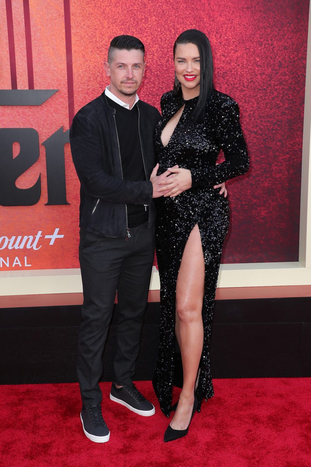 Model Adriana Lima walked a red carpet in a daring maternity dress that had  a cutout for her baby bump