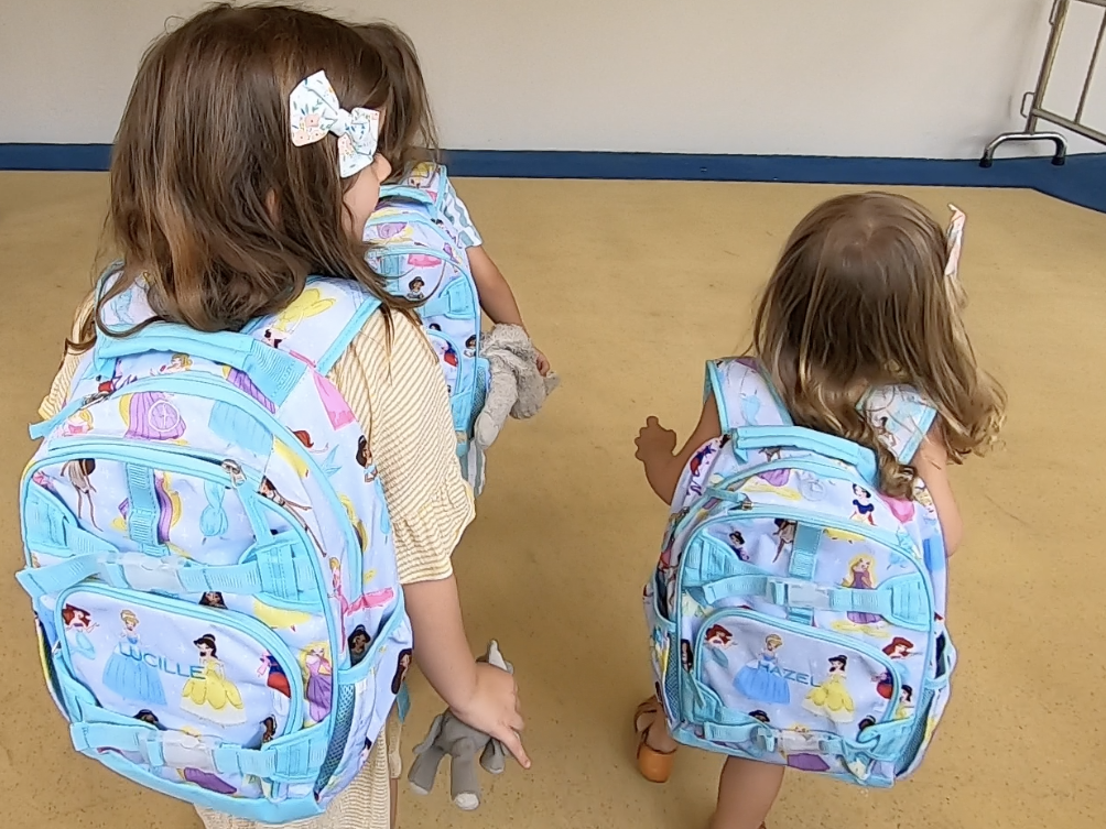 Diana Blinkhorn daughters wearing blue backpacks