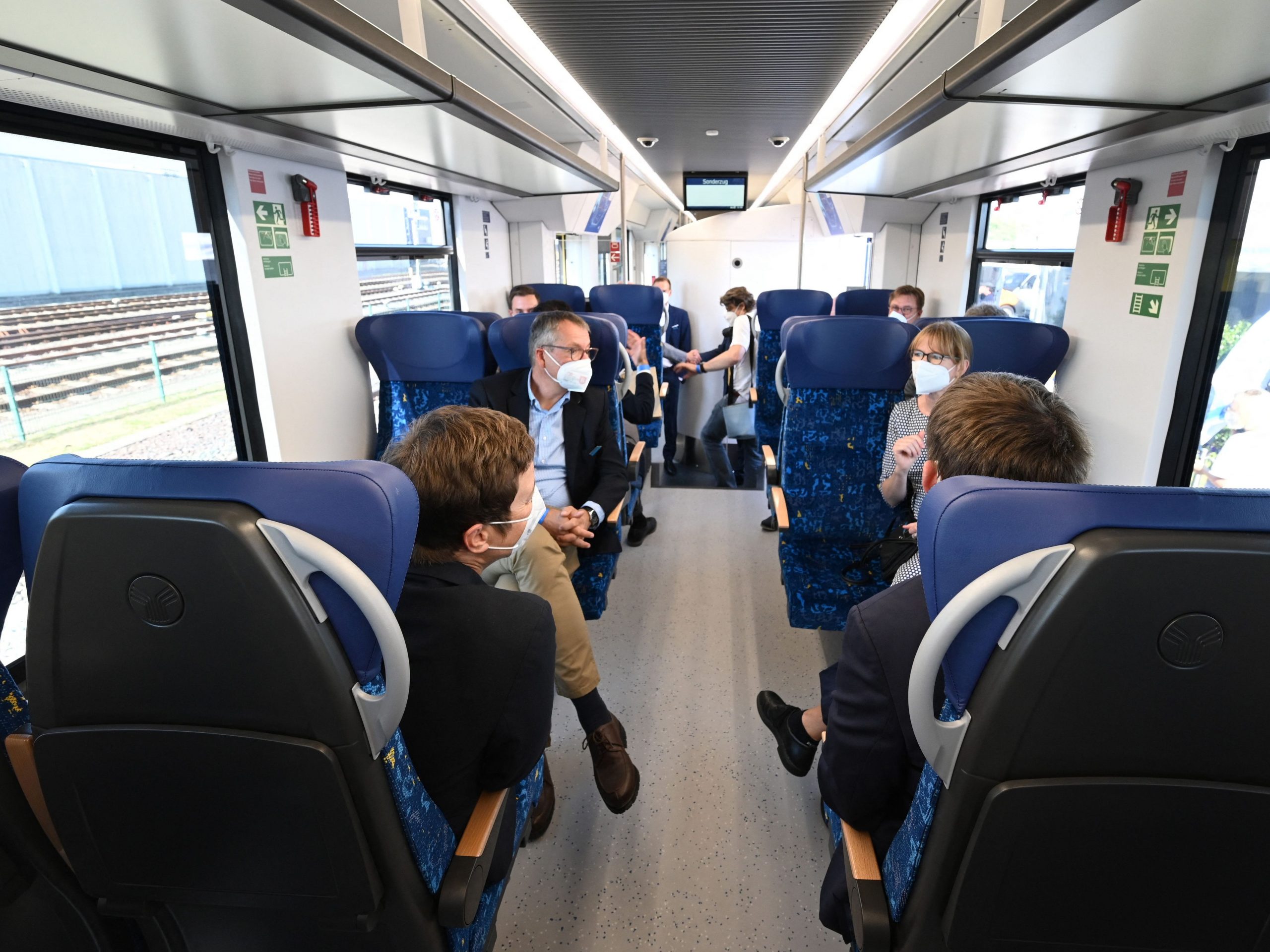 People sit inside a train powered entirely by hydrogen in Bremervoerde, on August 24, 2022.