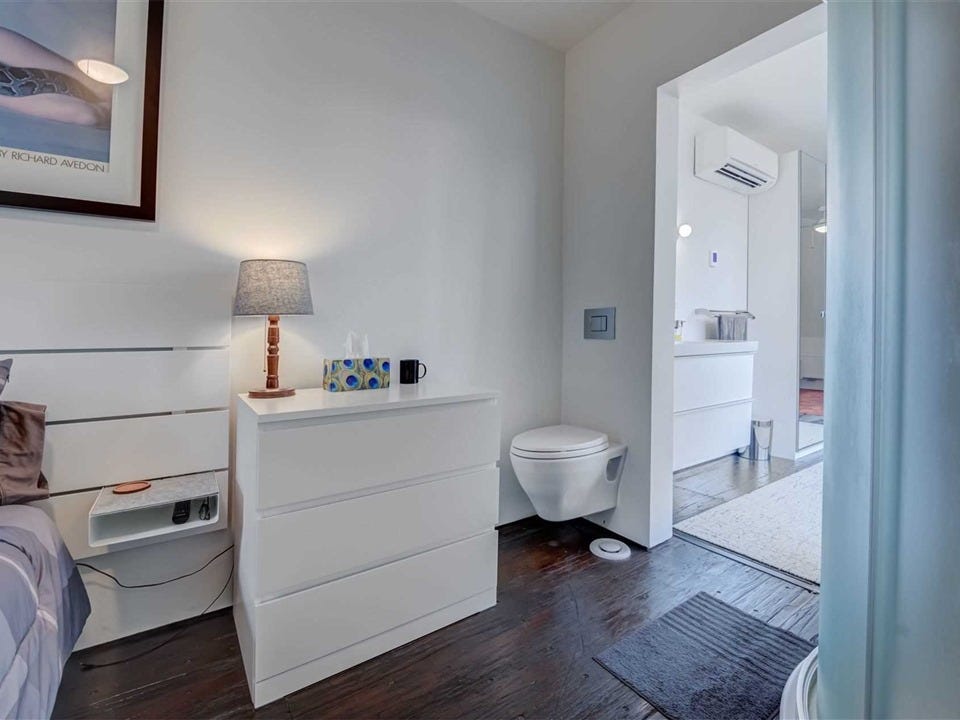 The owner even built a toilet in their bedroom, after it became apparent it would fit in the snug bathroom
