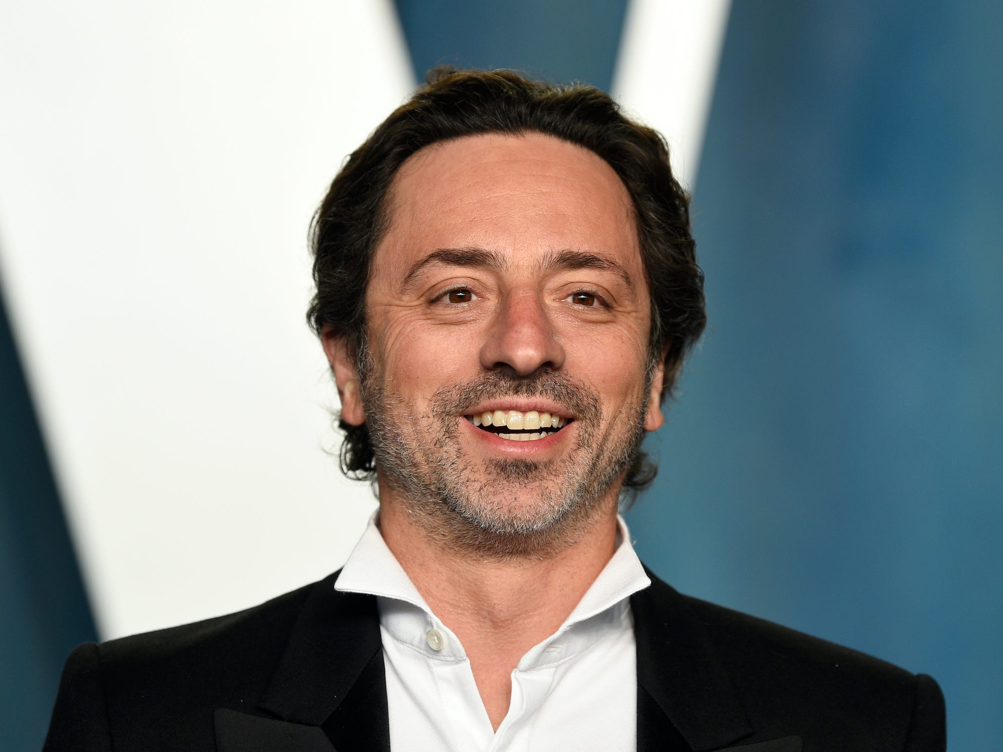 Close up of Sergey Brin smiling on red carpet after Oscars ceremony