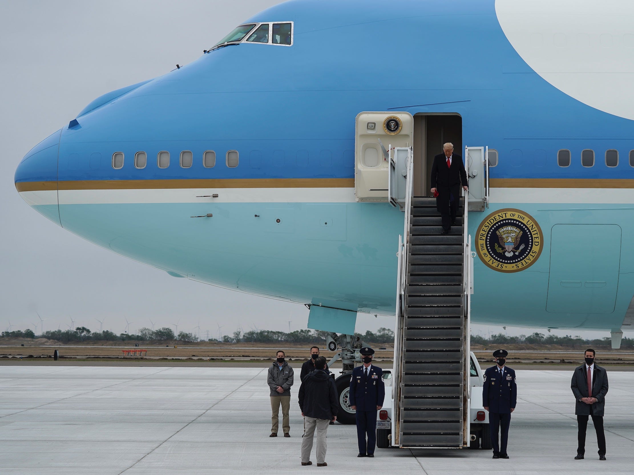 Trump stepping off Air Force One.