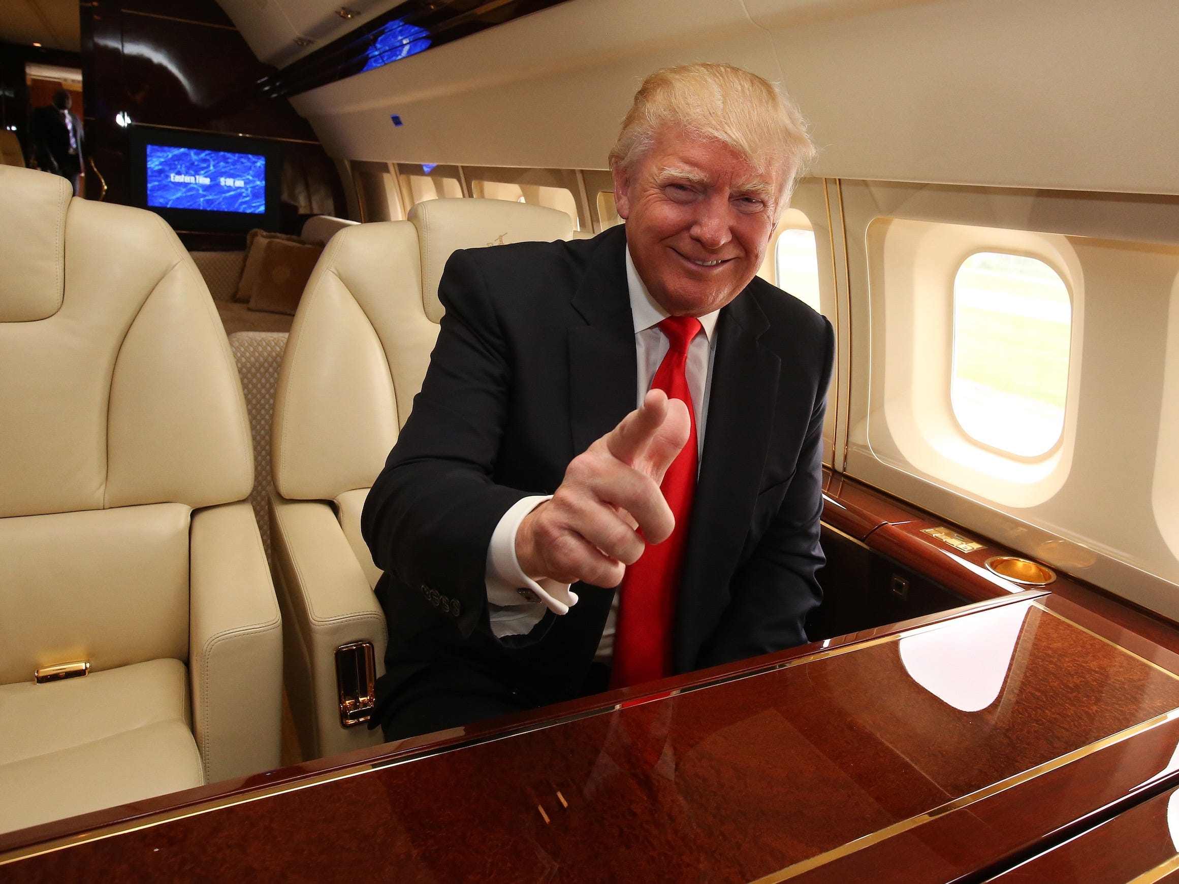 Trump onboard his Boeing 757 private jet.