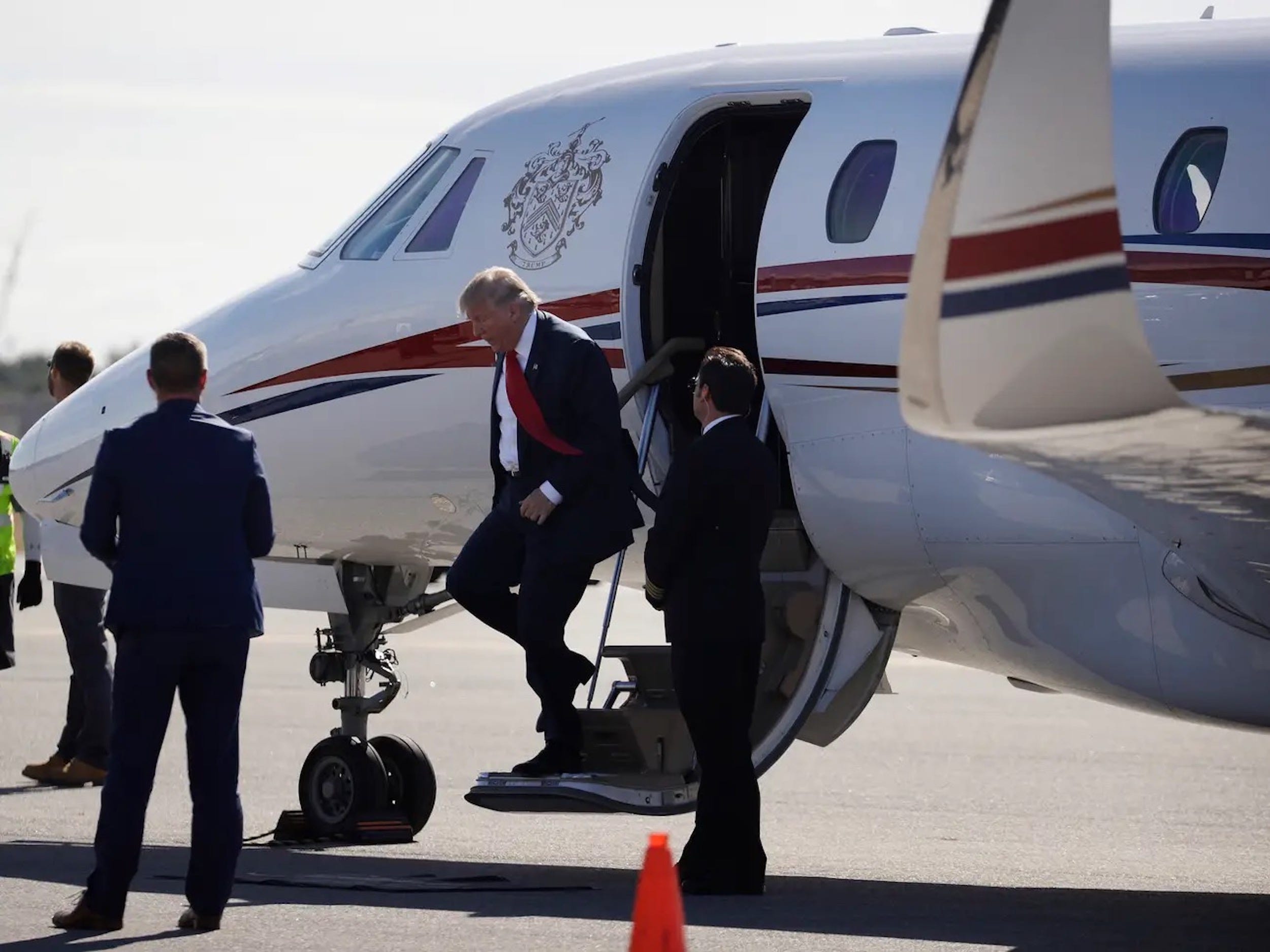 Trump stepping off his Cessna Citation X.