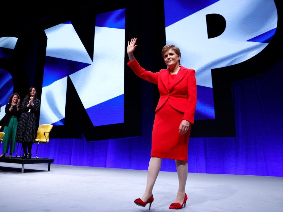 ABERDEEN, SCOTLAND - OCTOBER 10: Scottish First Minister Nicola Sturgeon receives applause after her keynote speech on day three of the Scottish National Party Conference in The Event Complex Aberdeen on October 10, 2022 in Aberdeen, Scotland. This is the first time Scottish National Party Members have met for an in-person conference since October 2019 due to the Covid pandemic. Among resolutions being discussed are homelessness, renewable energy, mitigating the effects of the cost-of-living crisis and raising the school starting age. (Photo by Jeff J Mitchell/Getty Images)