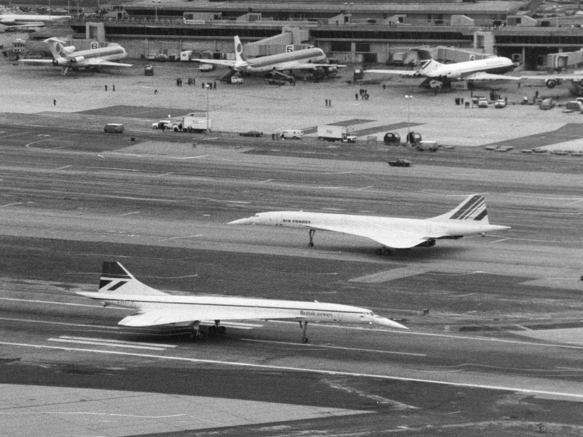 A BA and AF Concorde pass each other at JFK.