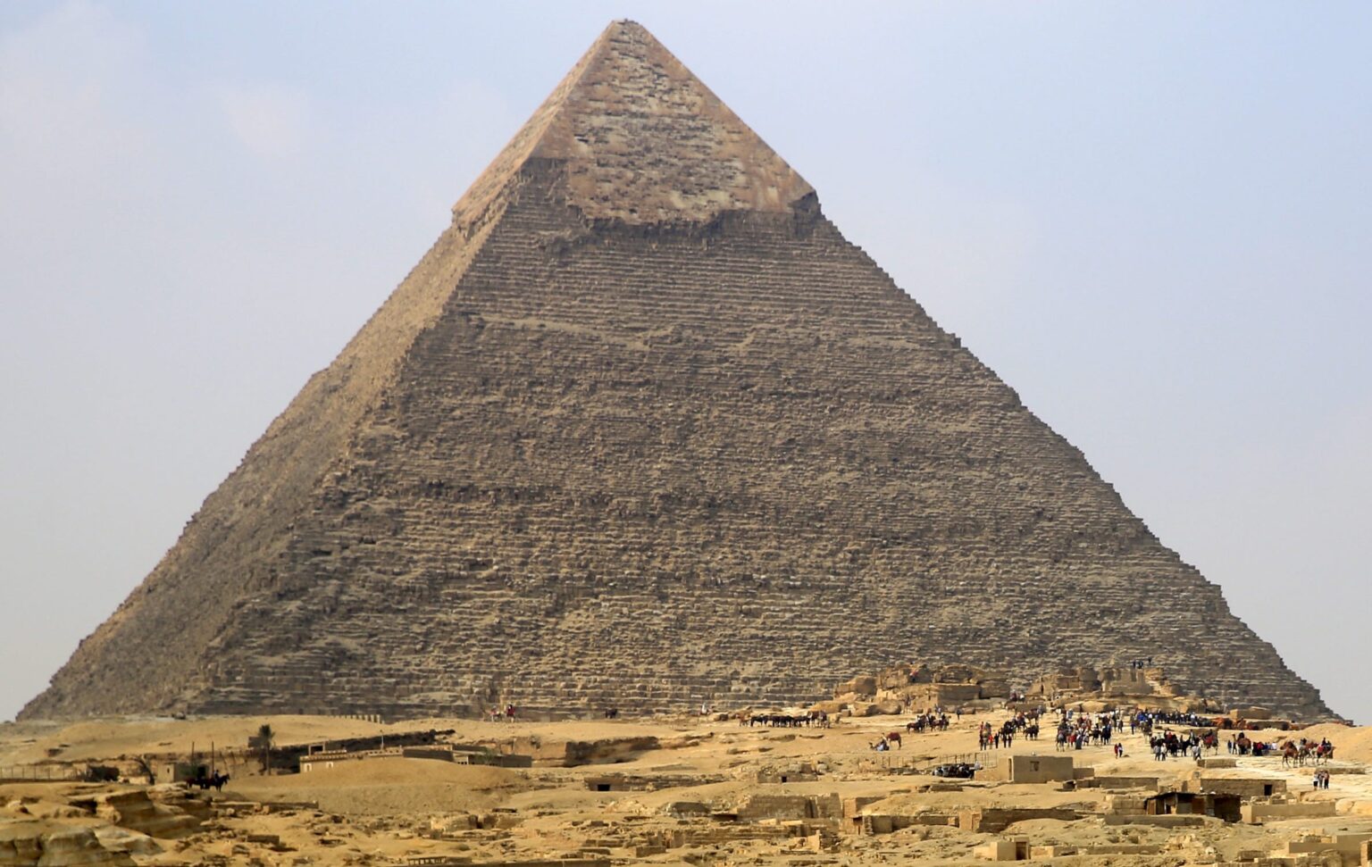 On Pluto you could throw a baseball over the Great Pyramid of Giza, a ...