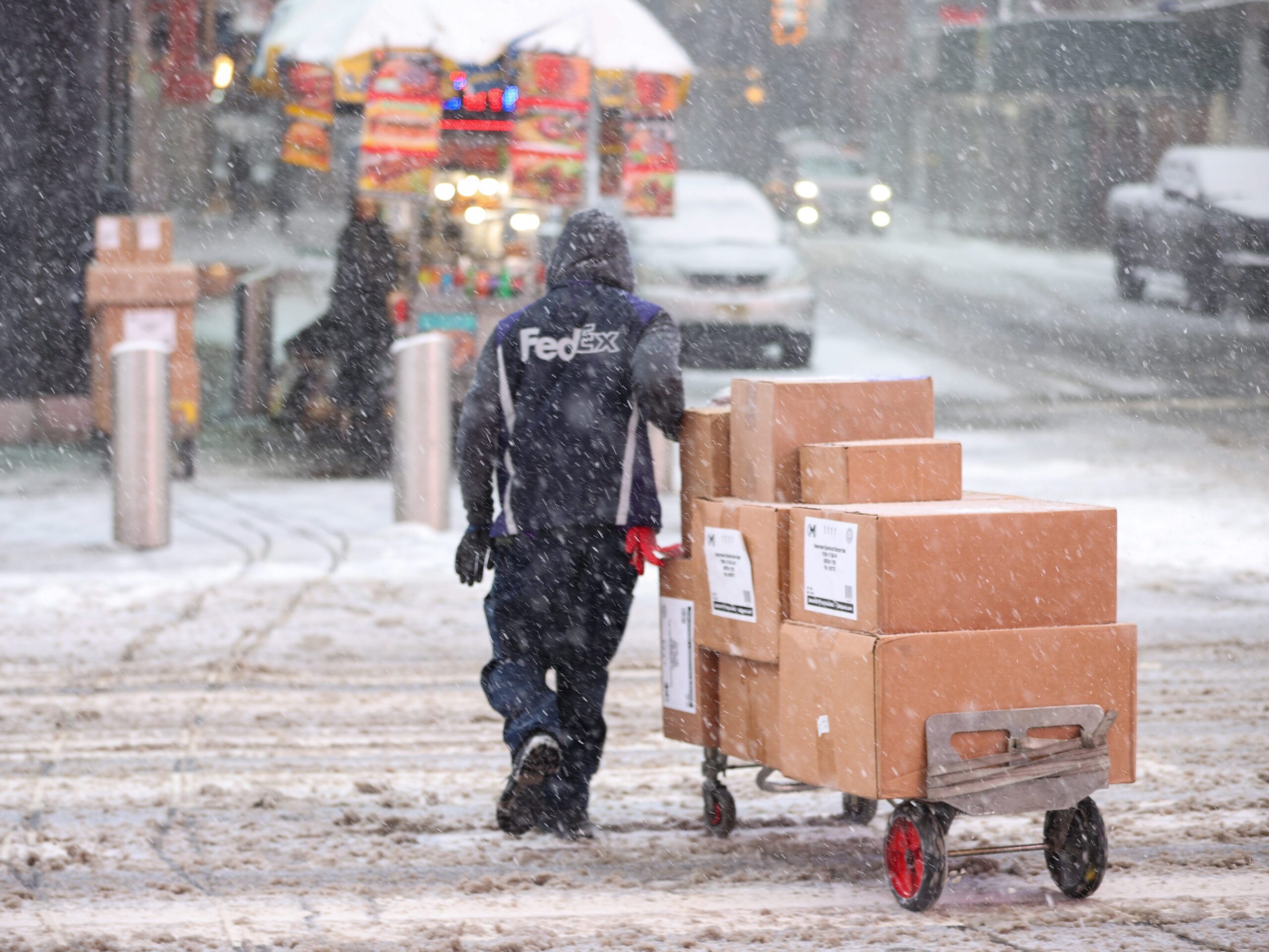 Man delivering packages in the snow