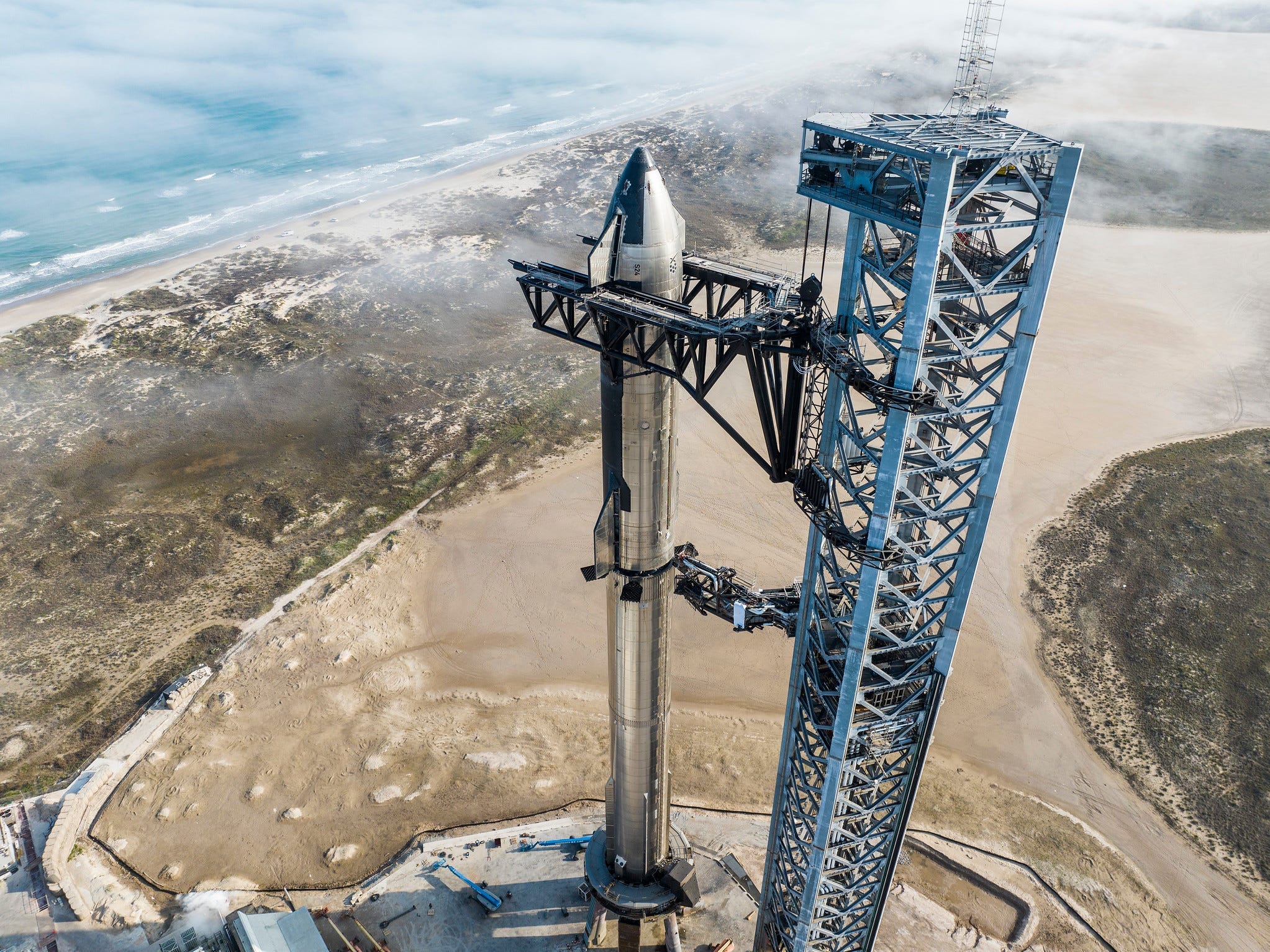 A picture from the top of the rocket shows how high it is next to the landscape.