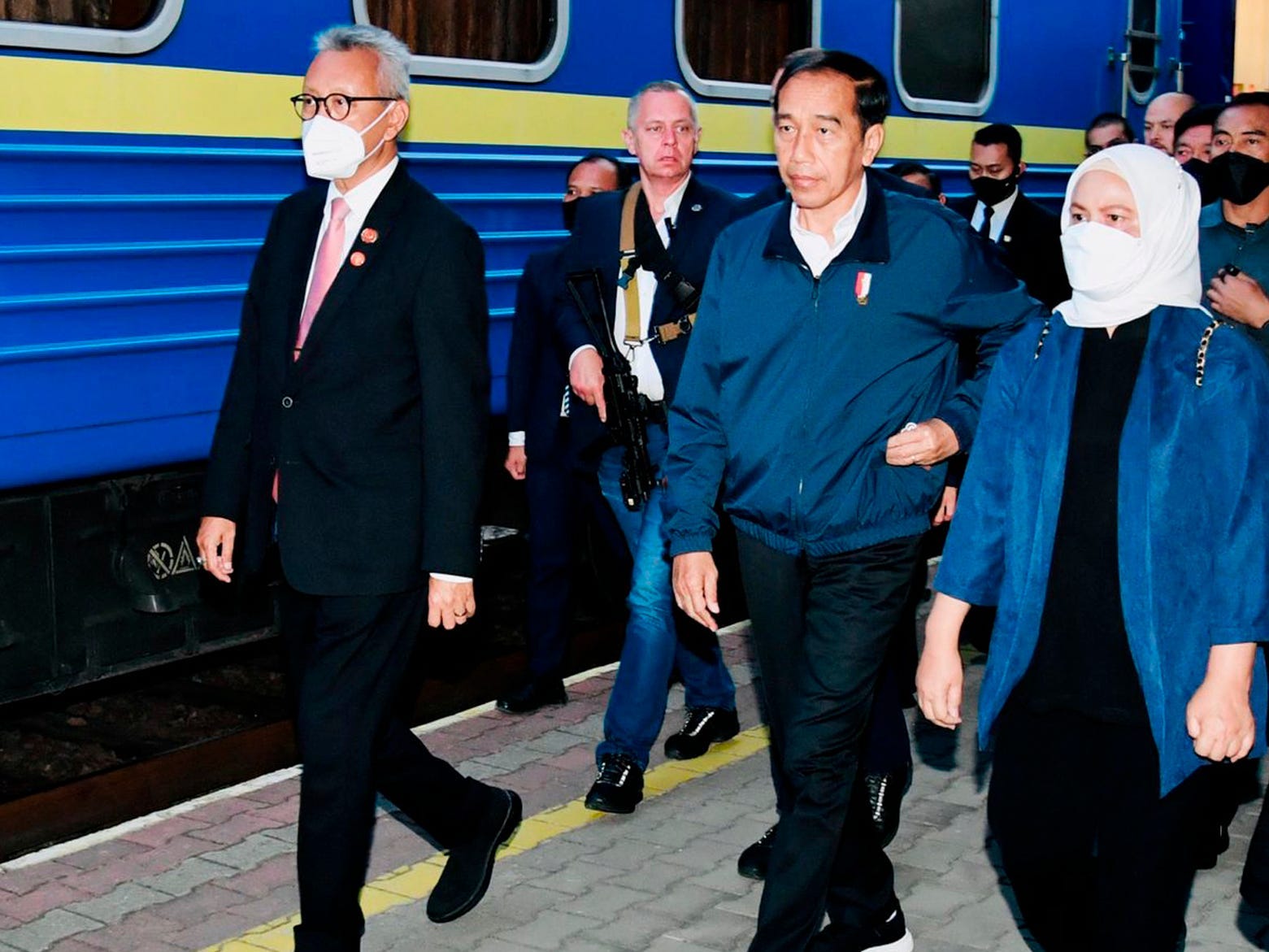 Indonesian President Joko Widodo, second right, and his wife Iriana, right, walk on the platform prior to boarding a train that will take them to Kyiv, Ukraine, at a railway station in Przemysl, Poland in June.