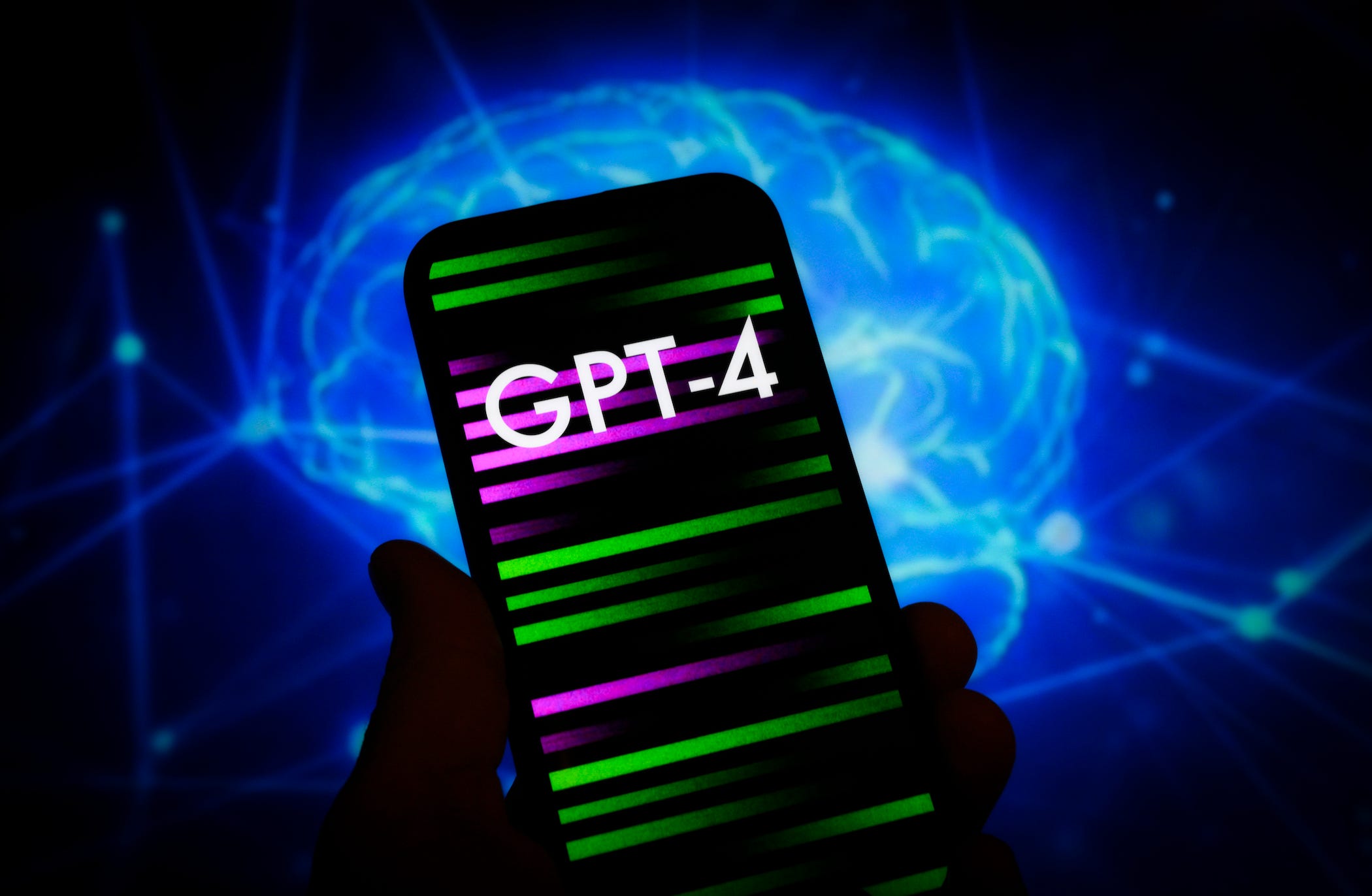 person holding phone with the word &#39;gpt-4&#39; on it