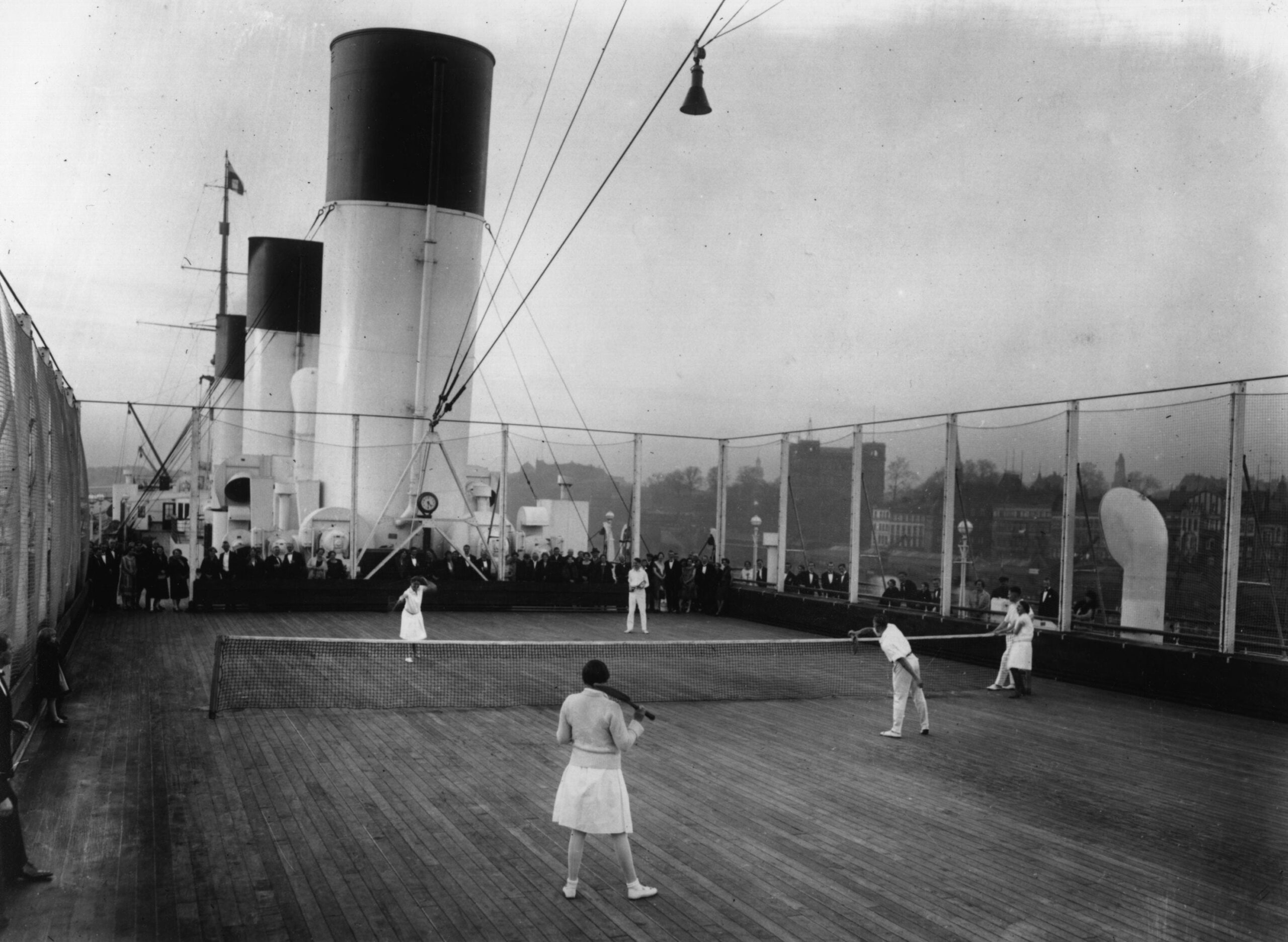 Passengers playing tennis aboard the liner SS Cap Areona.