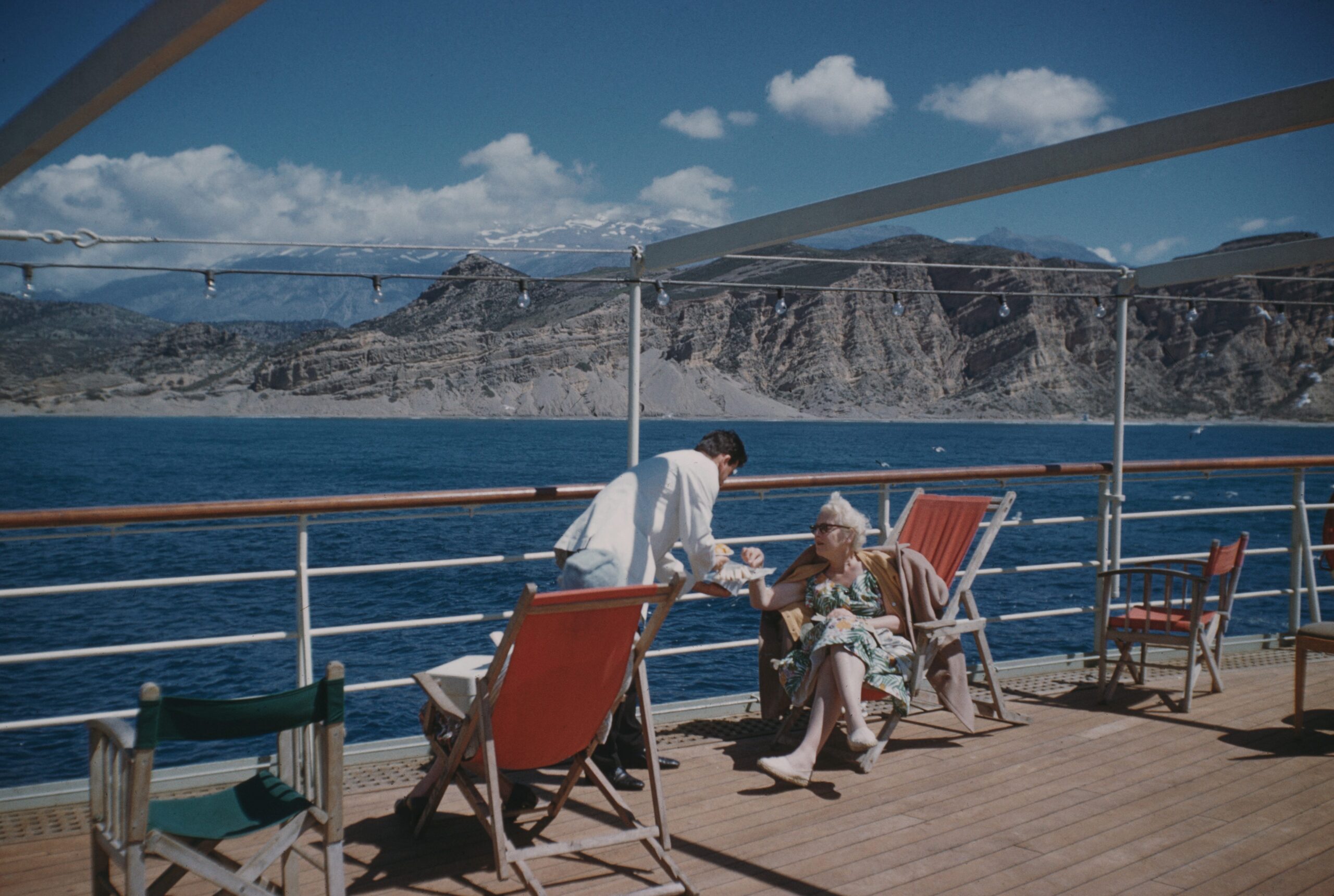 A mid-morning snack on the cruise ship &#39;Agamemnon&#39;, anchored off Agia Galini in southern Crete, Greece, 12th April 1959.