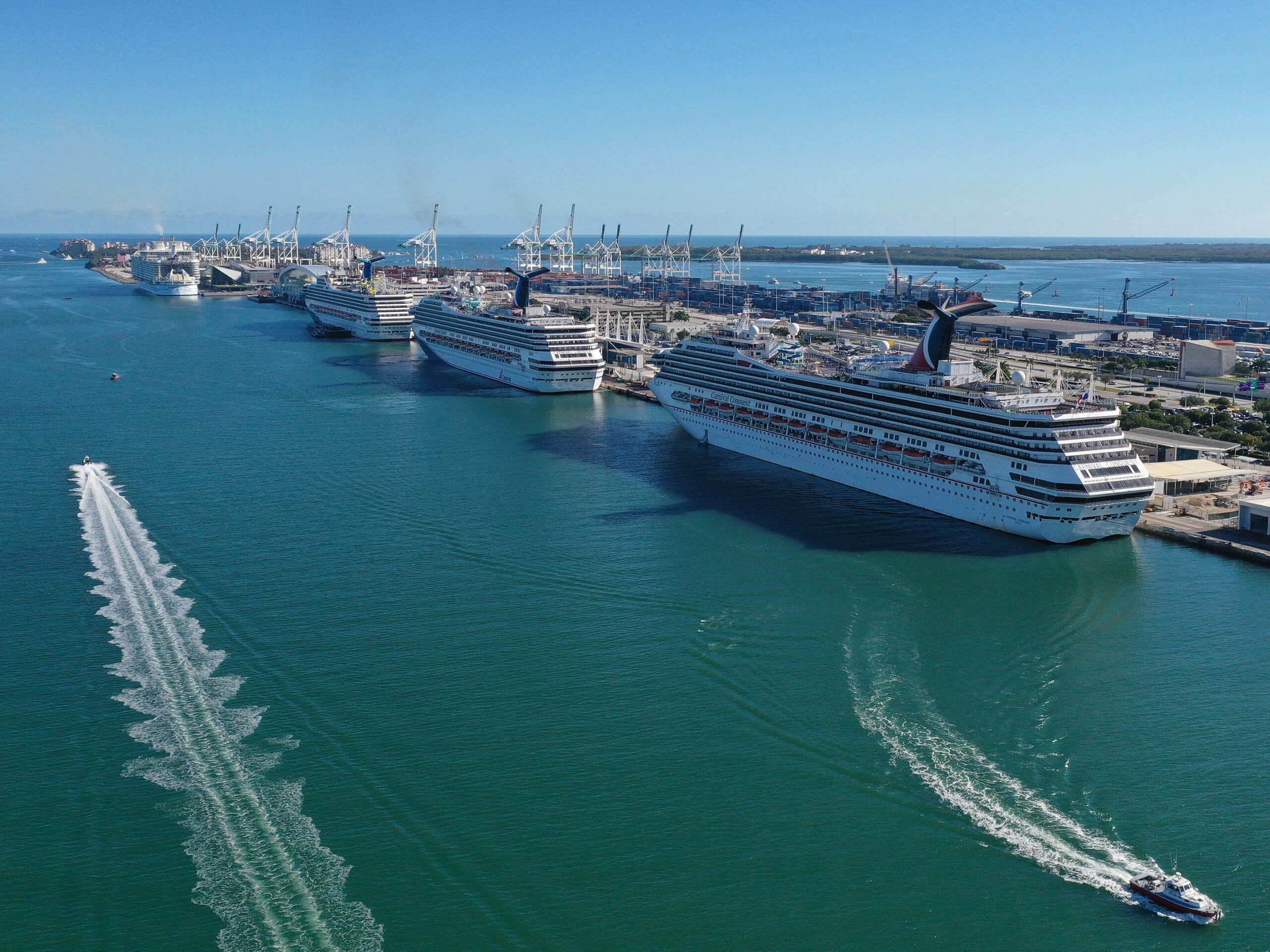 Cruise ships wait for people to embark before leaving Port of Miami on December 31, 2021 in Miami, Florida.