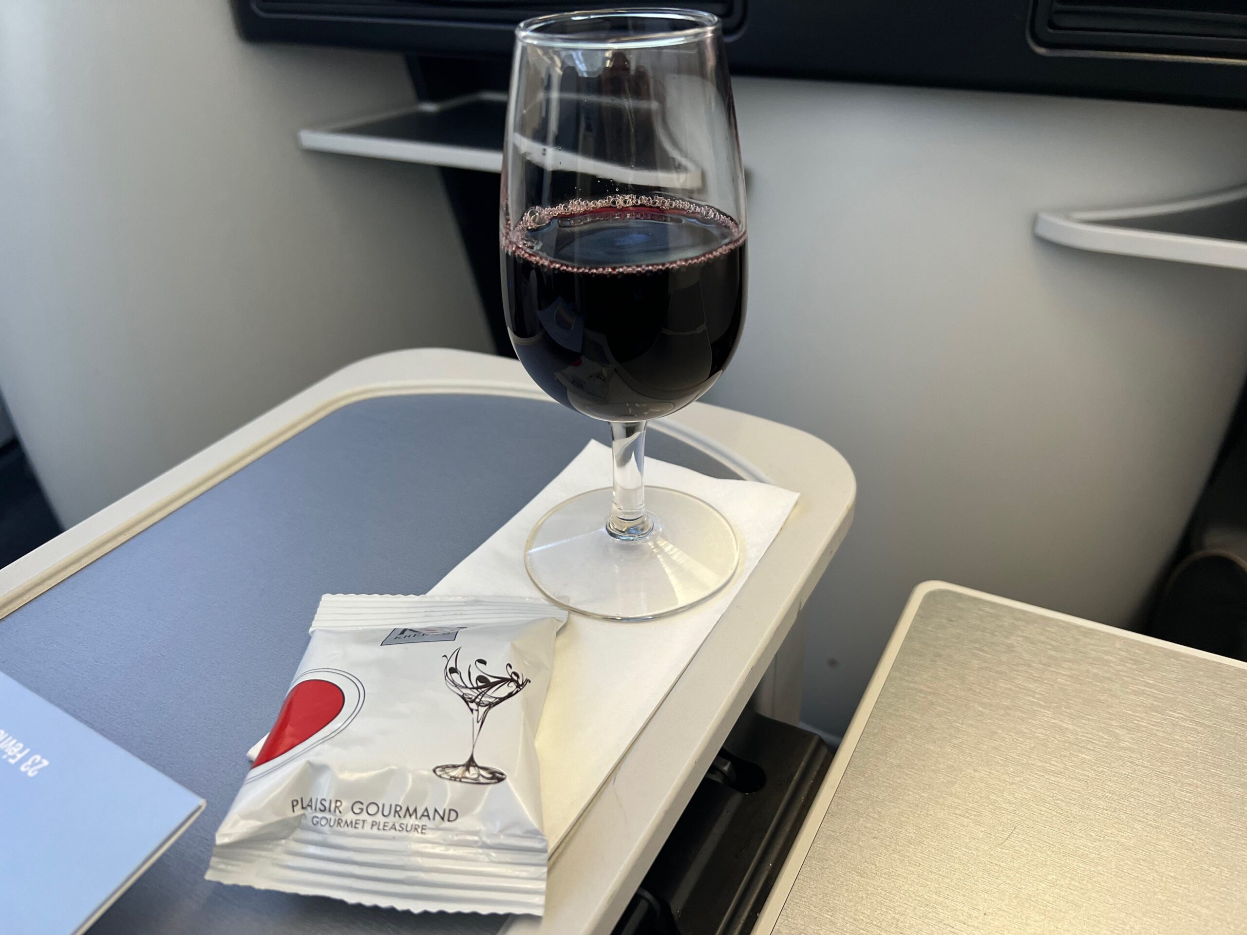 Flying on La Compagnie all-business class airline from Paris to New York &mdash; the wine and nuts.