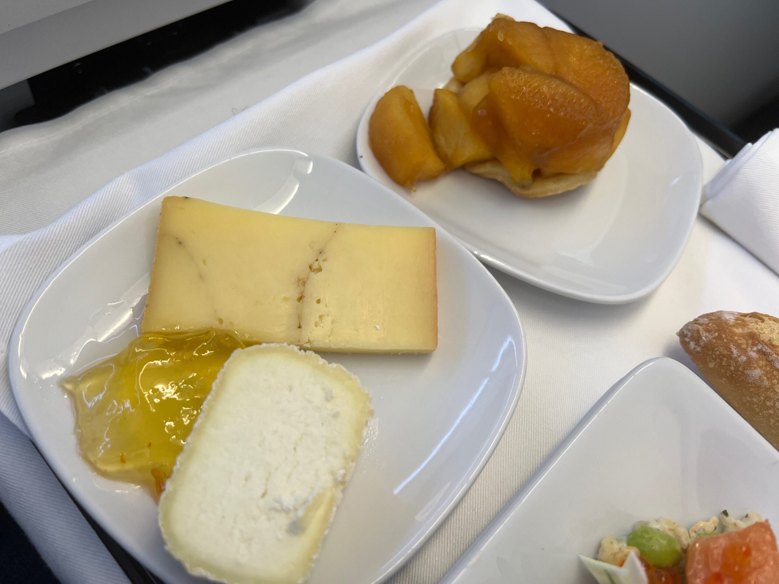 Flying on La Compagnie all-business class airline from Paris to New York &mdash; the cheese plate and apple tart.