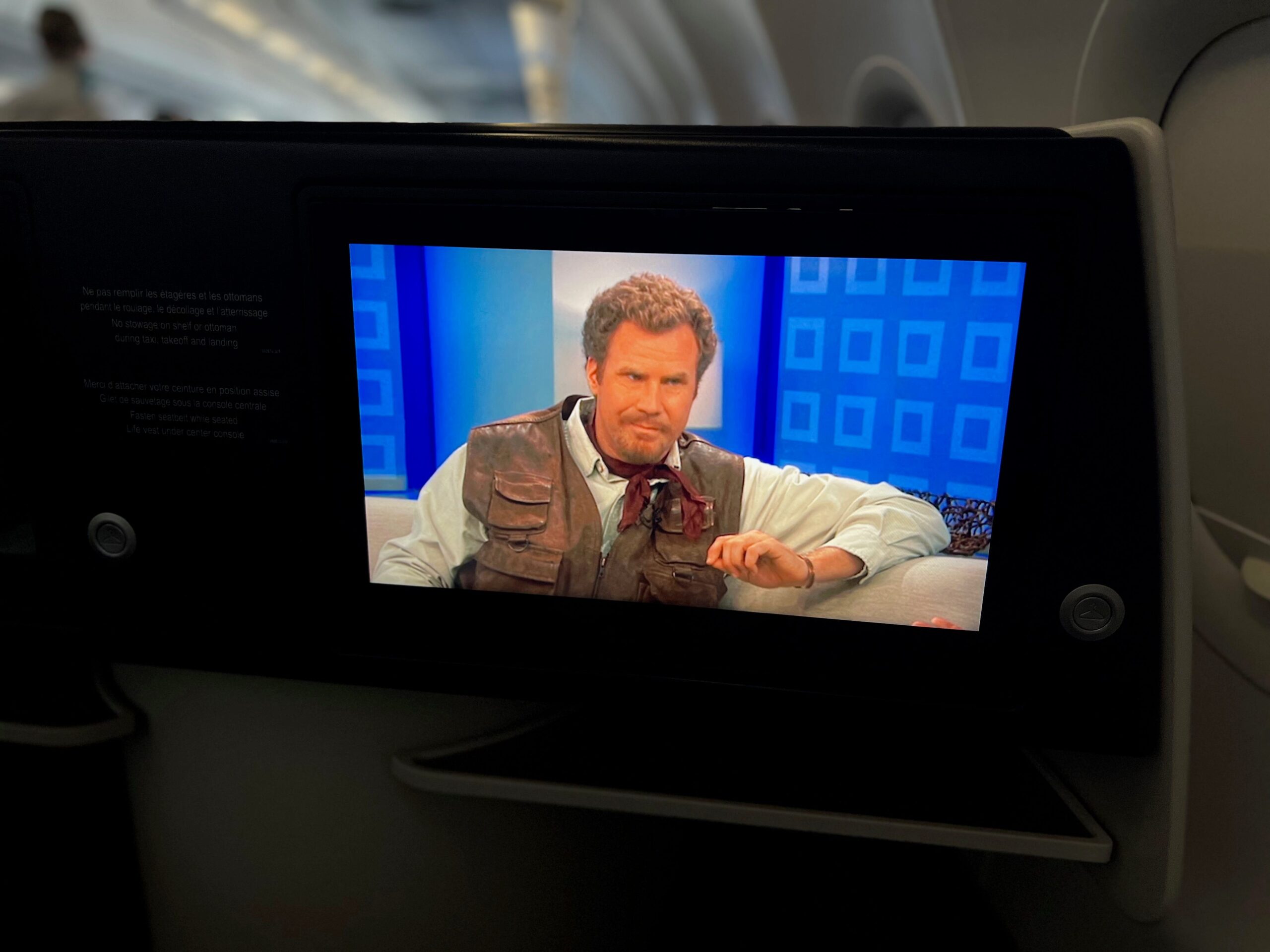 Flying on La Compagnie all-business class airline from Paris to New York &mdash; Land of the Lost playing.
