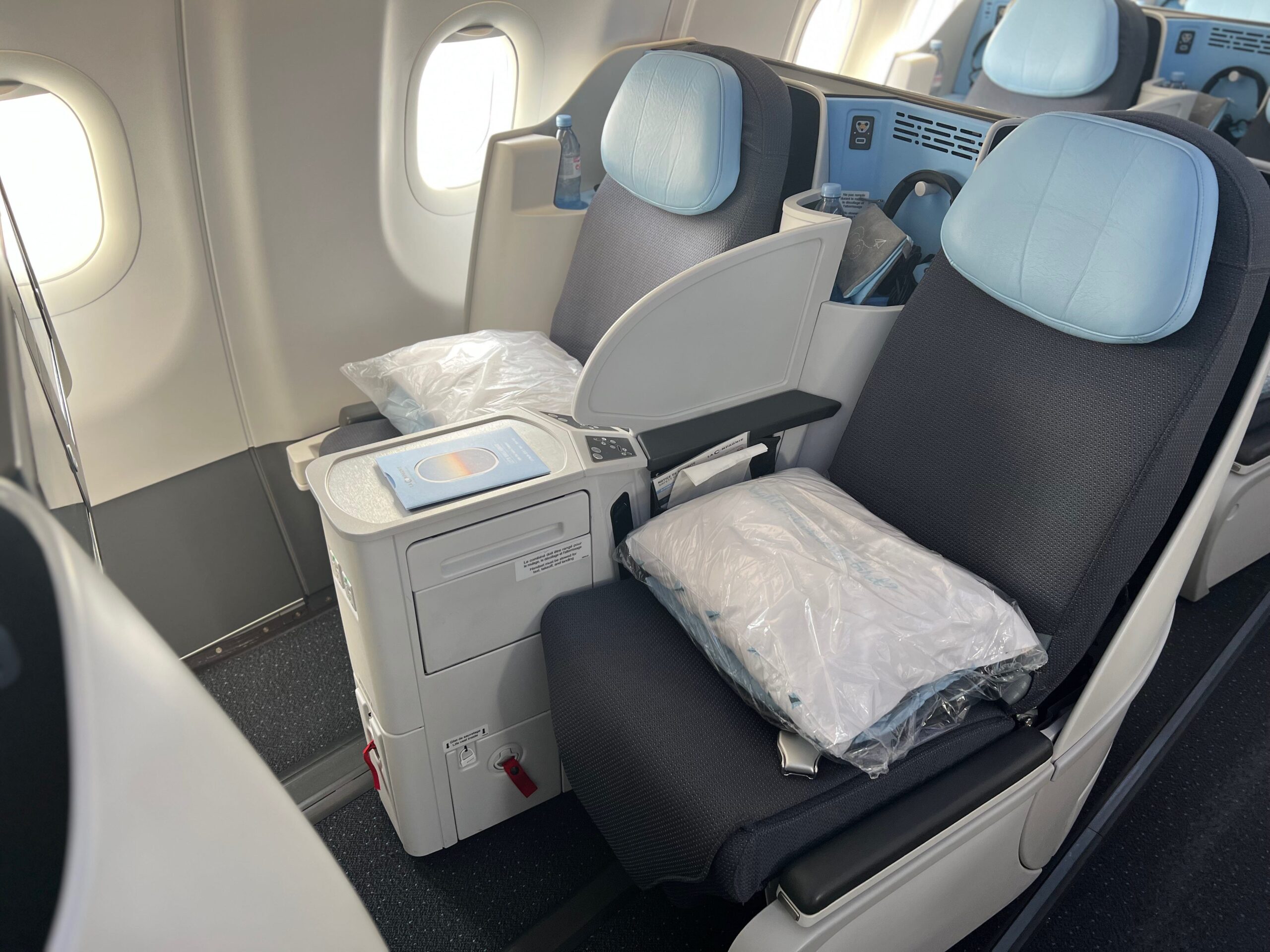 Flying on La Compagnie all-business class airline from Paris to New York &mdash; two loungers.