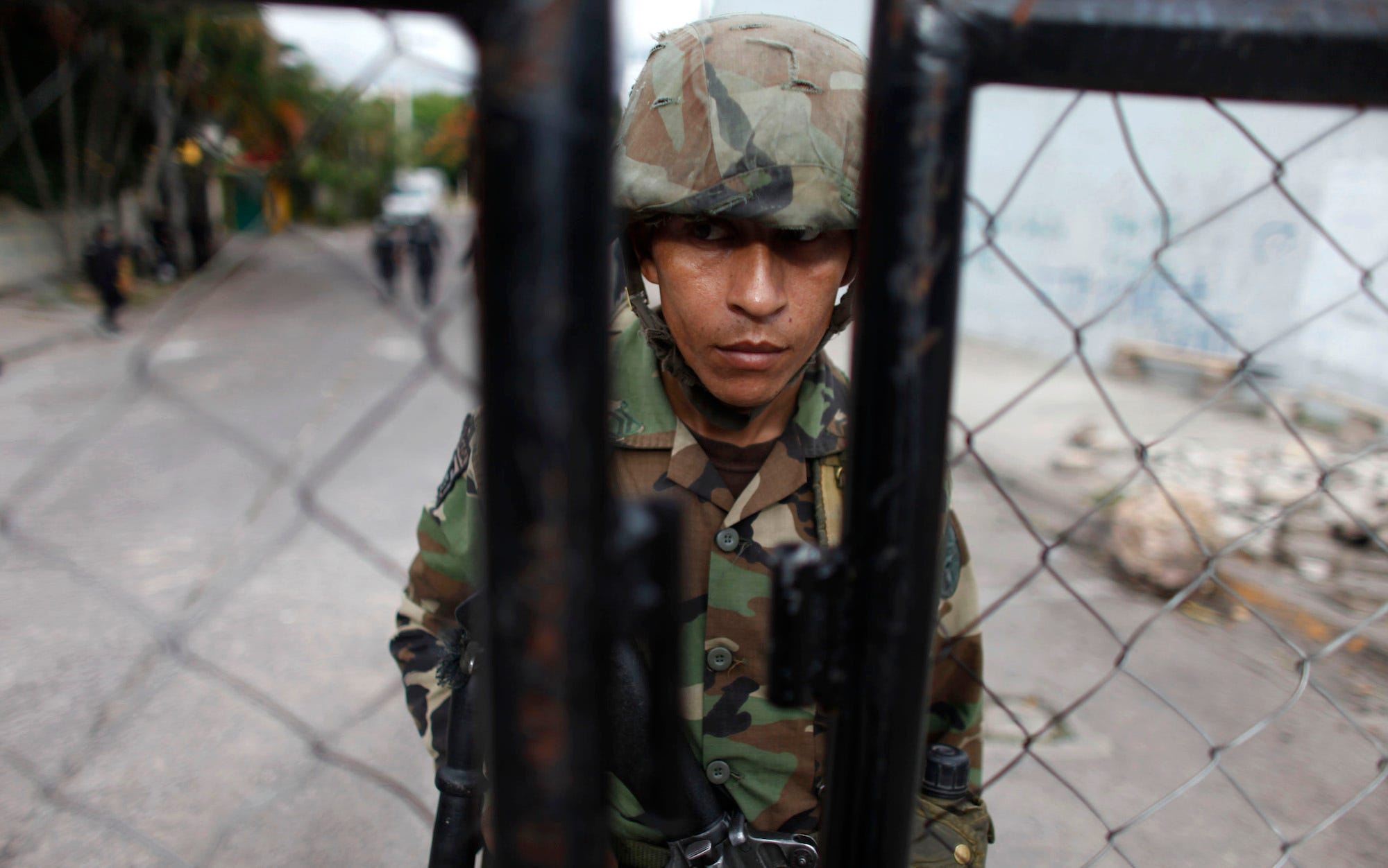 A soldier stands guard outside the Brazilian embassy in Tegucigalpa September 24, 2009.