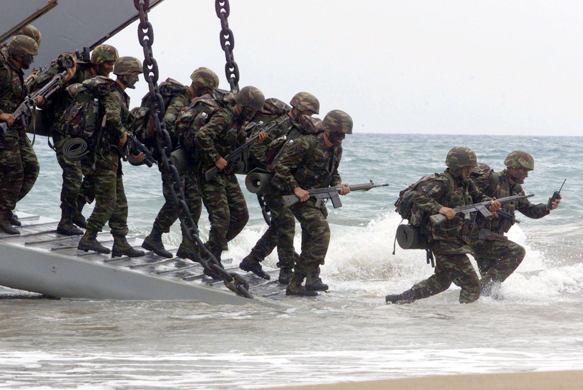 Turkish marines land at a coast near Greece&#39;s southwestern village of Kyparissia during a phase of the NATO &#34; Dynamic Mix&#34; exercise in June 2000.