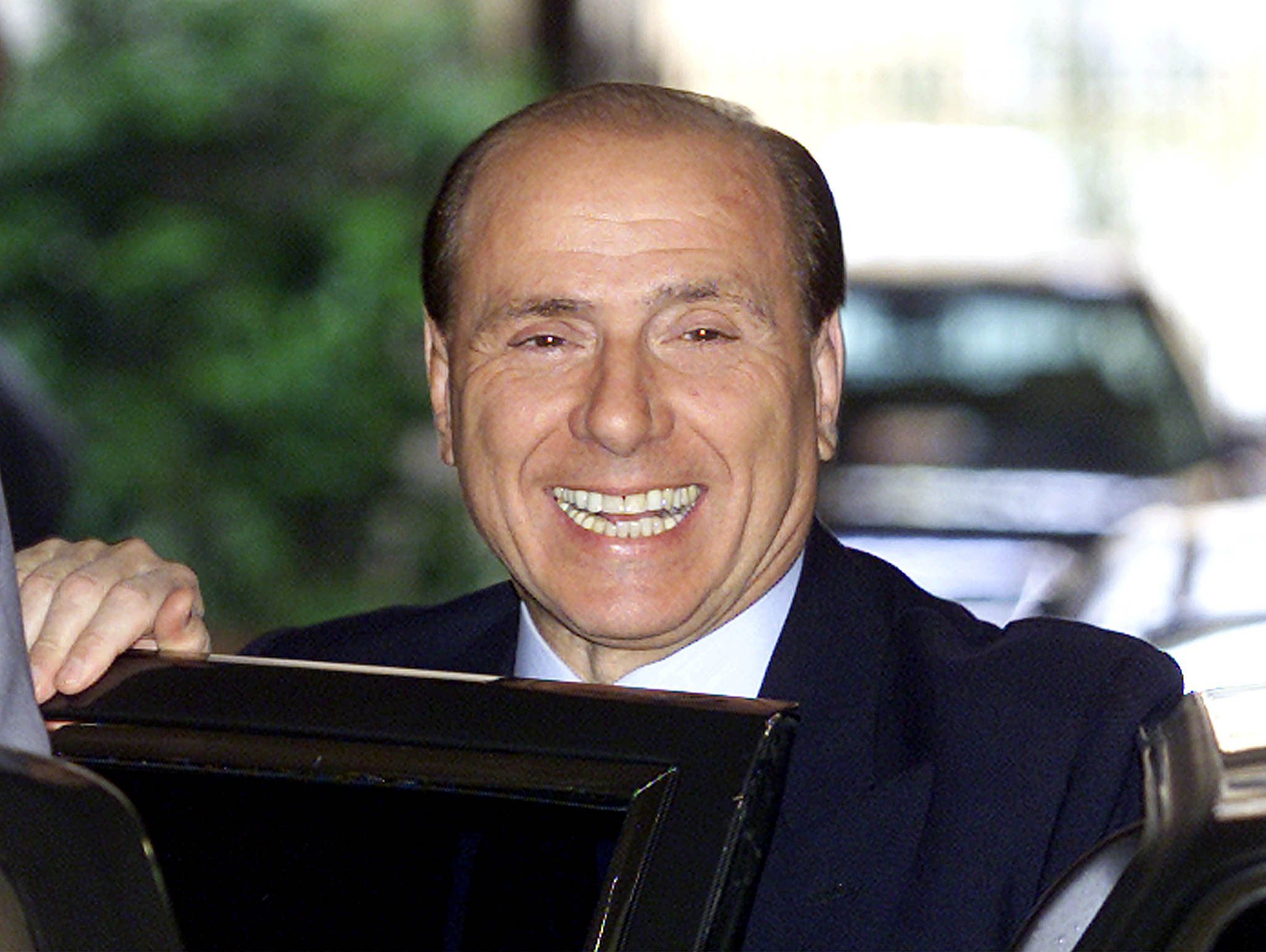 De karakteristieke glimlach waar Berlusconi zijn hele carrière lang mensen mee probeerde te verleiden. EPA/DANILO SCHIAVELLA