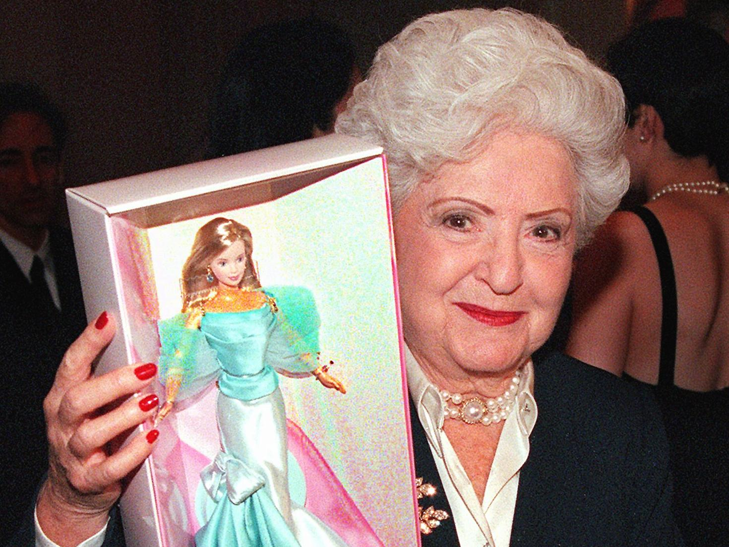 Ruth Handler, inventor of Barbies, holds a Barbie doll