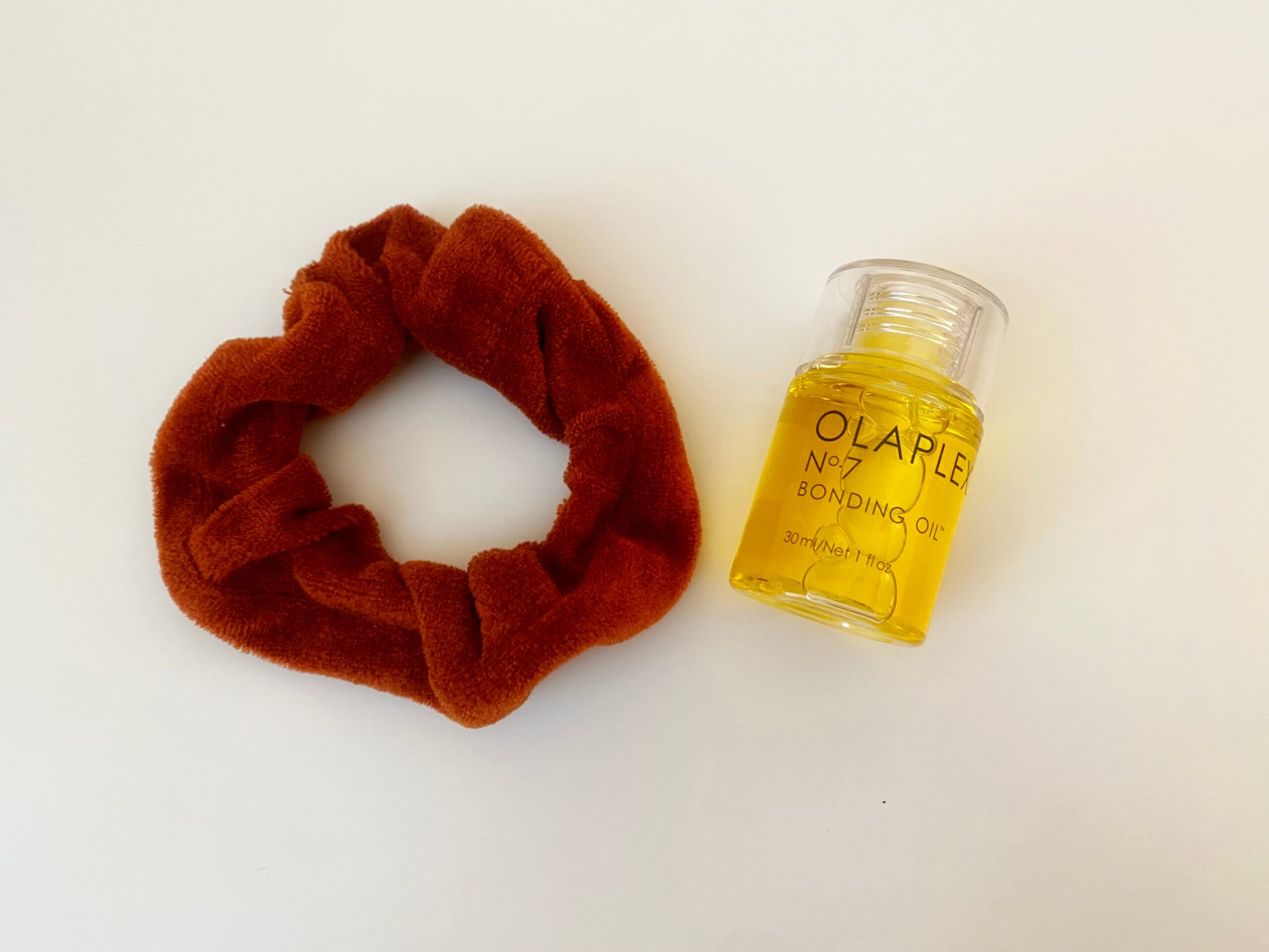Olaplex Bonding Oil and hair scrunchie