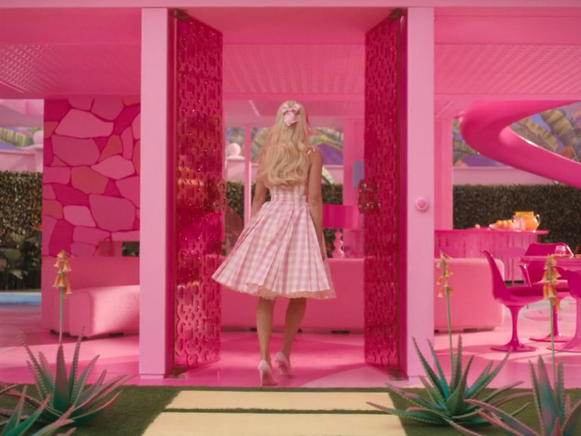 barbie walks into her dreamhouse in the movie. it&#39;s bright pink and has no exterior walls