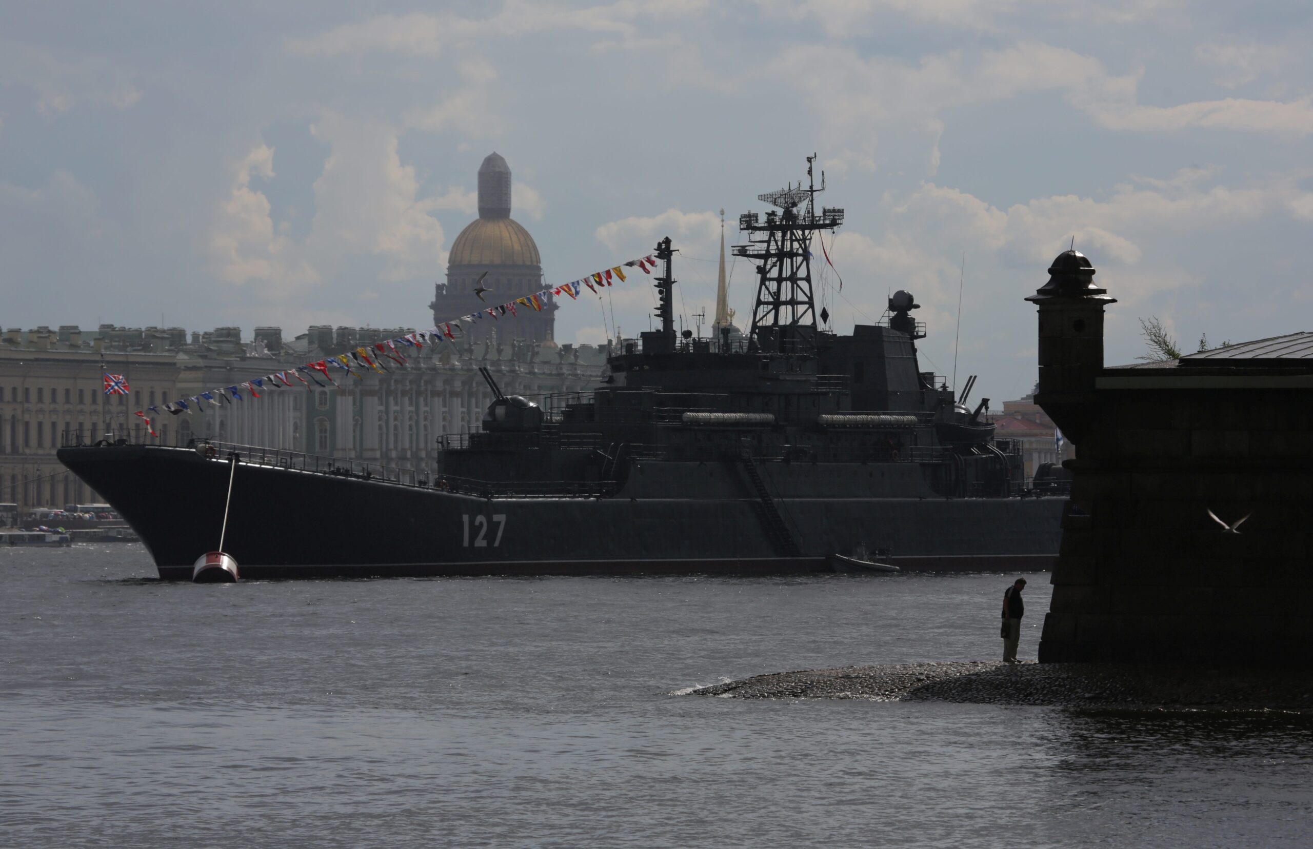 Russian Navy&#39;s large landing ship Minsk is seen in the Neva river, with Saint Isaac&#39;s Cathedral and Hermitage Museum seen in the background, in St. Petersburg, Russia