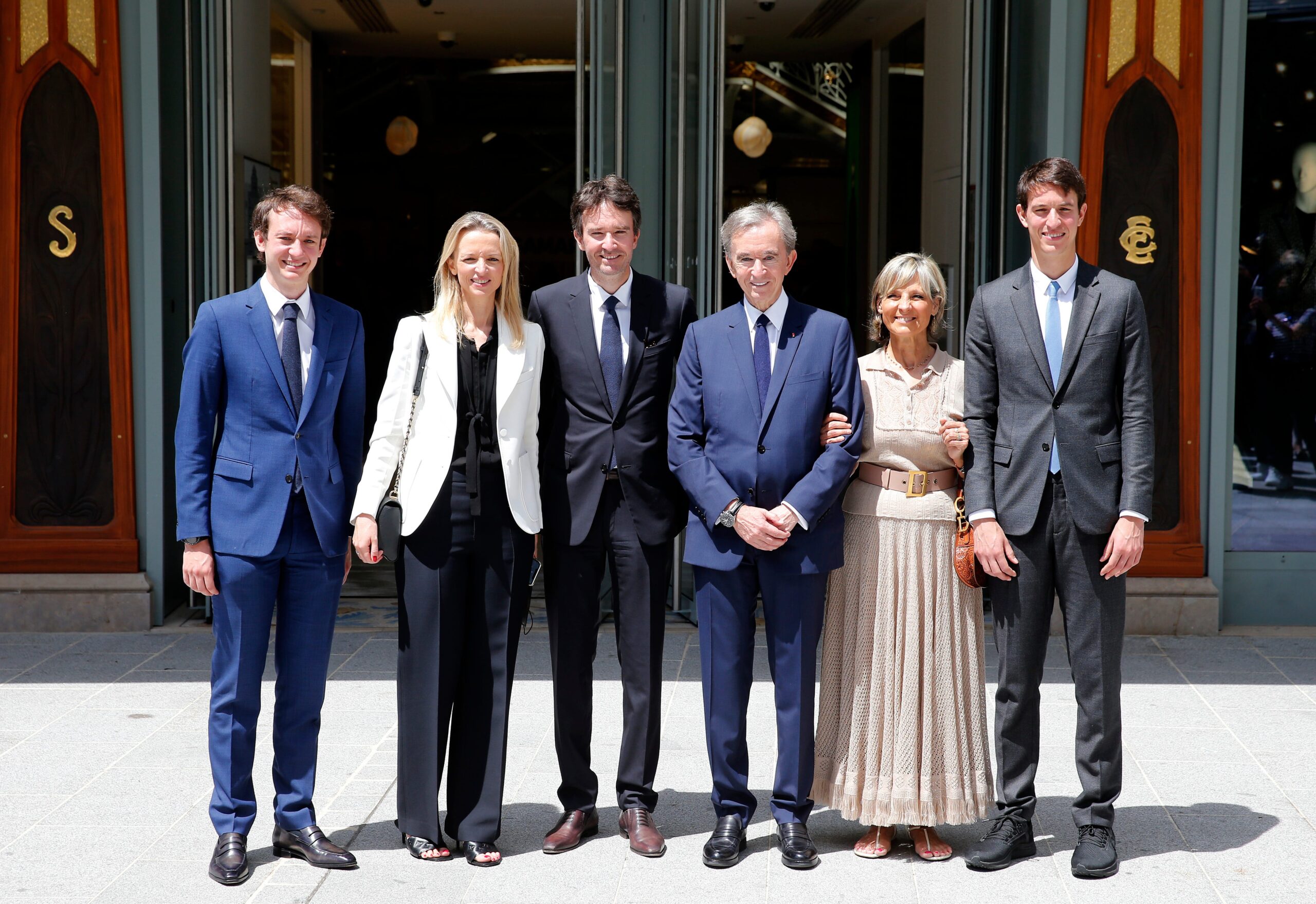 Bernard Arnault and his wife and children standing posing 